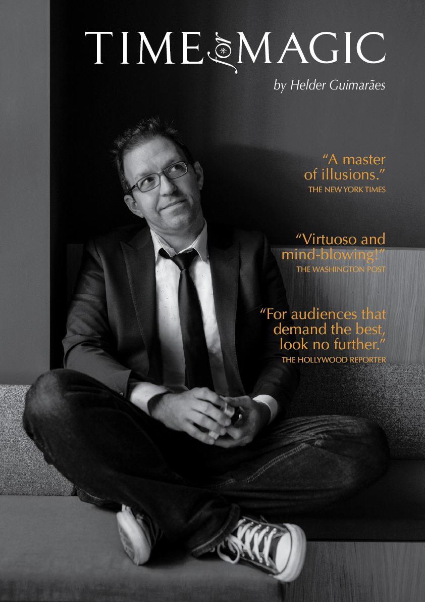 Black and white magazine cover featuring Helder Guimarães sitting cross-legged on a couch, wearing glasses, a blazer, a shirt, a tie, and sneakers. The title reads 'Time for Magic' by Helder Guimarães, with quotes praising his illusions.