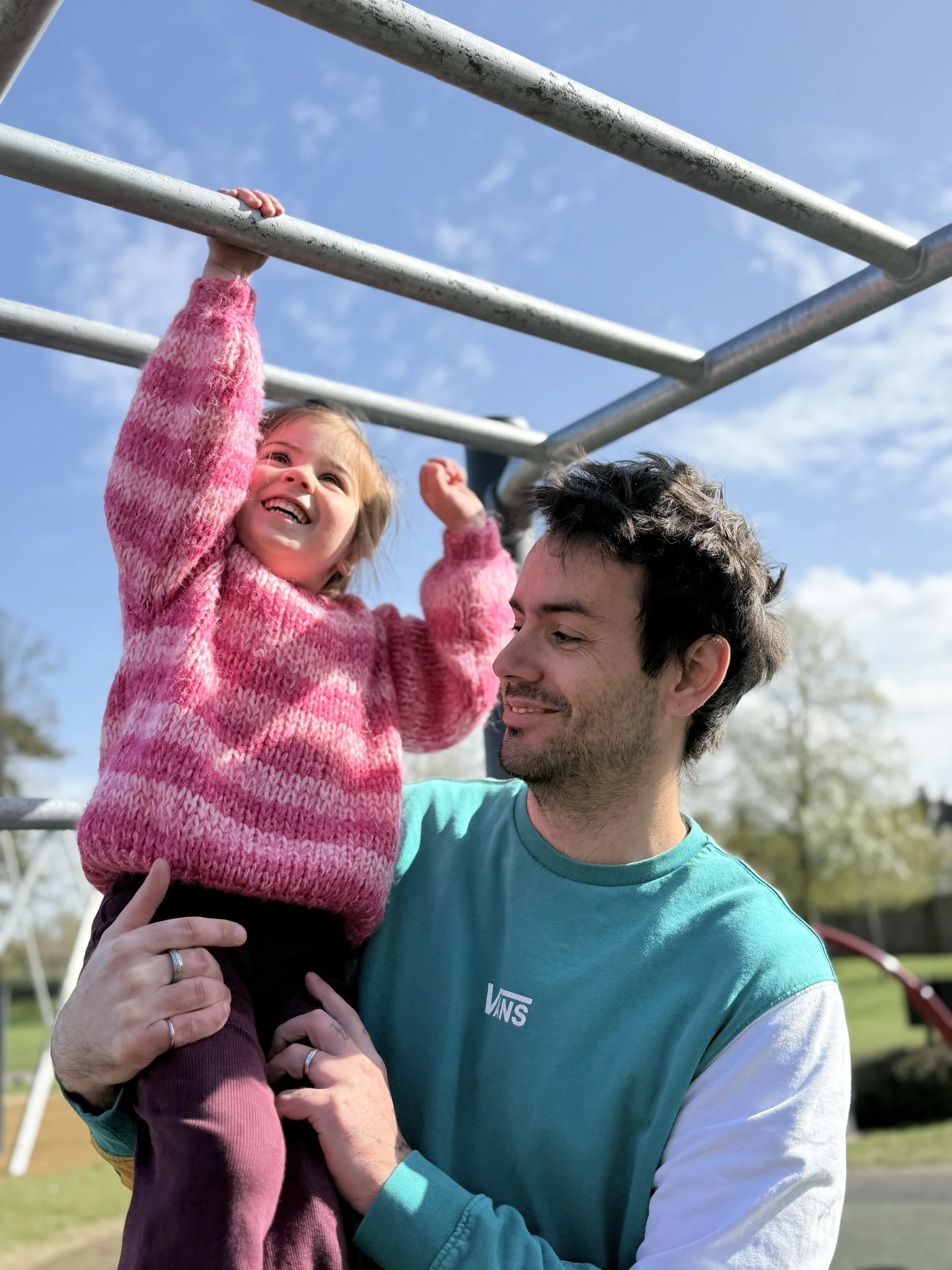 Father and daughter playing together in the park