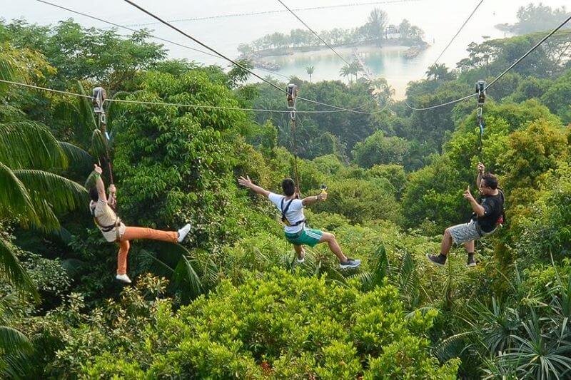 People zip lining on sentosa singapore