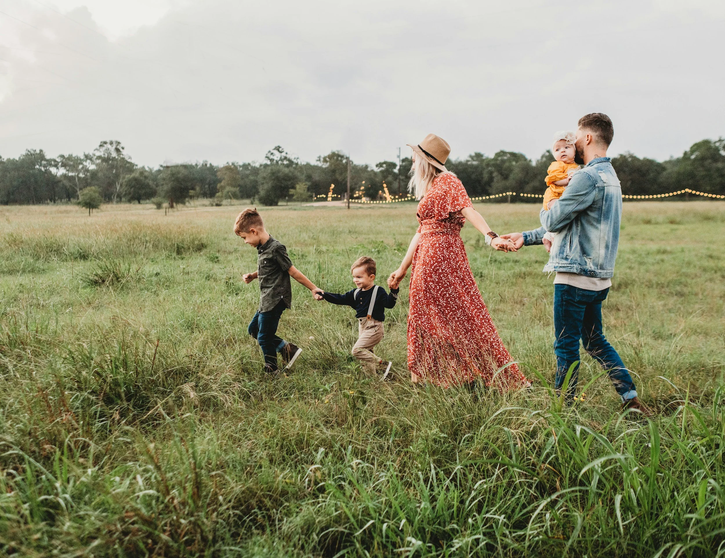 Family walking through countryside illustrating financial planning for families, long term wealth management and future financial security