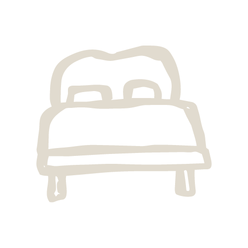 Simple line drawing of a bed with two pillows.