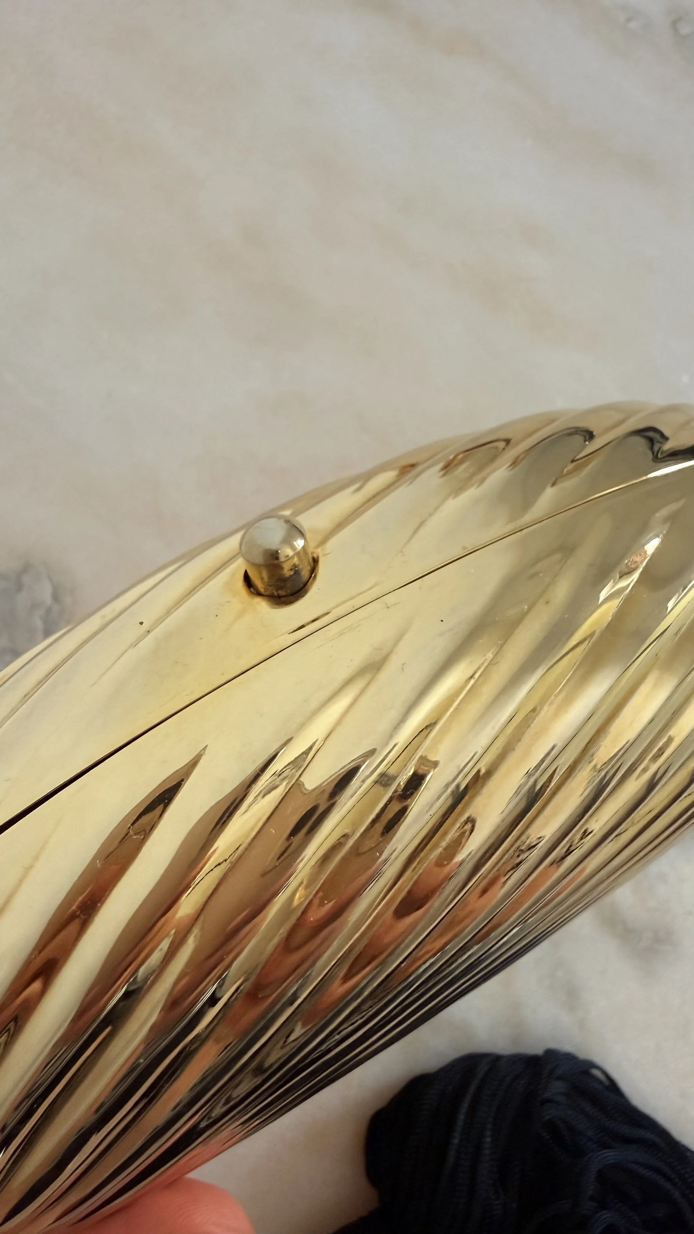 GOLD RIBBED EGG MINAUDIÈRE WITH TWO TASSELS 7.jpeg