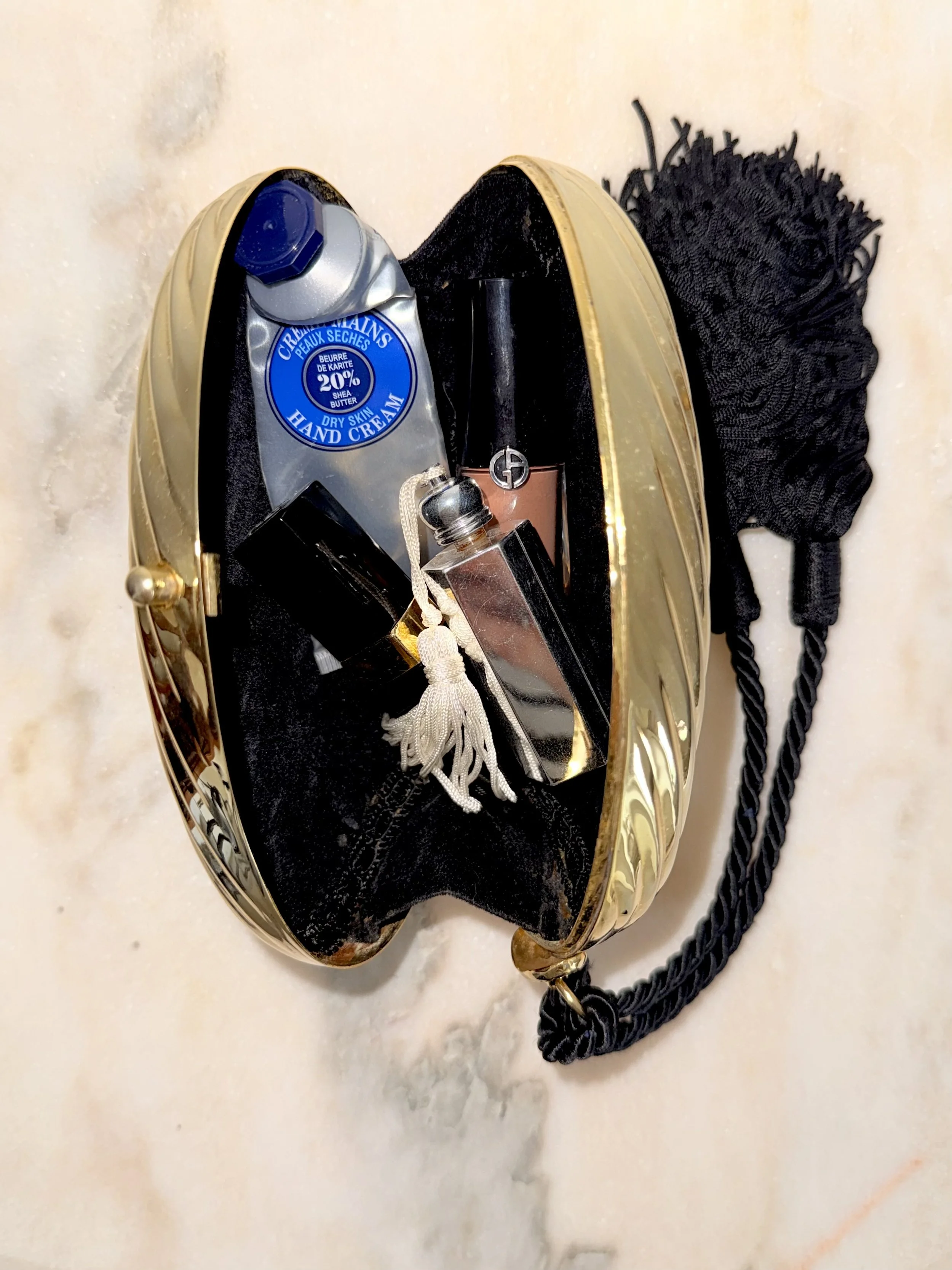 GOLD RIBBED EGG MINAUDIÈRE WITH TWO TASSELS 14.jpeg