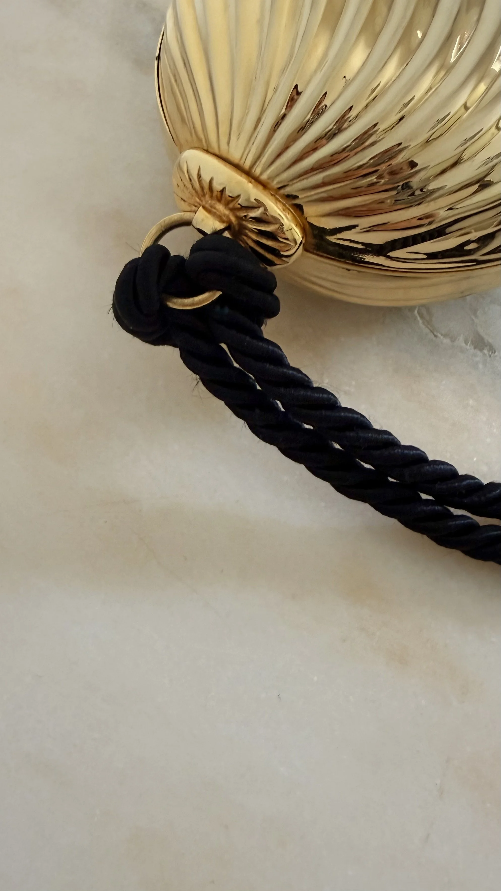 GOLD RIBBED EGG MINAUDIÈRE WITH TWO TASSELS 12 (2).jpeg