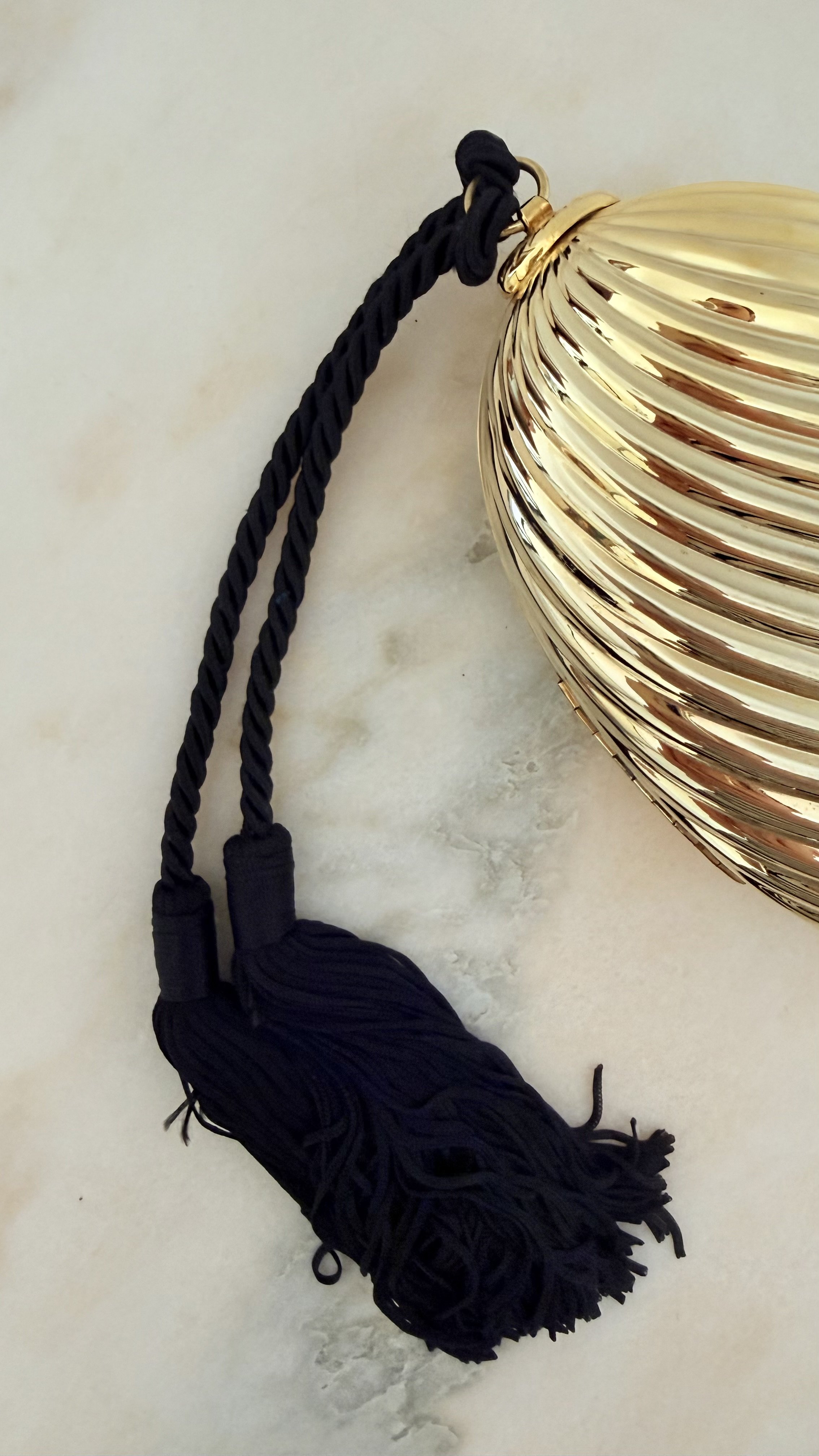 GOLD RIBBED EGG MINAUDIÈRE WITH TWO TASSELS 4.jpeg