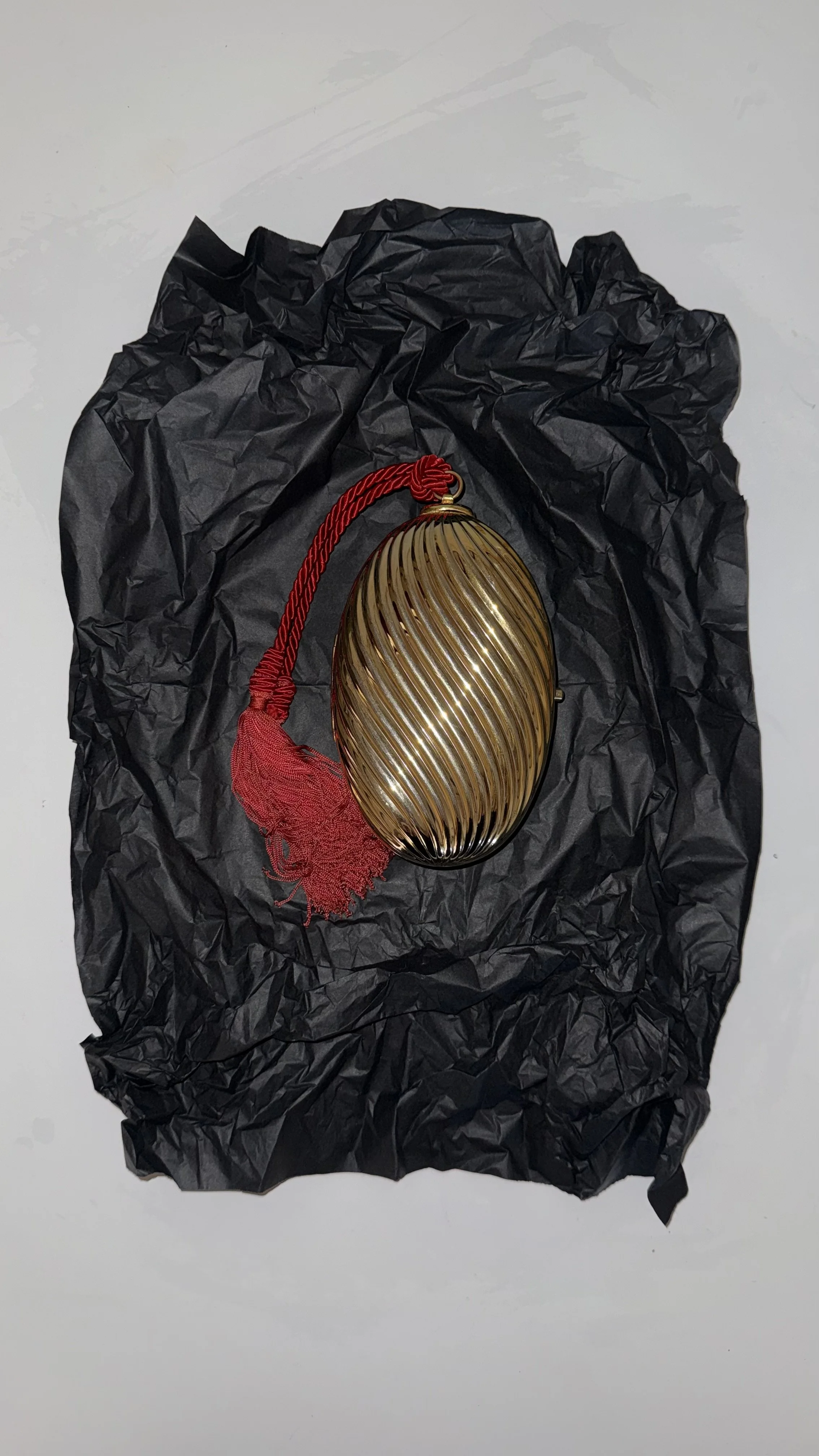 GOLD RIBBED EGG MINAUDIÈRE WITH TWO TASSELS 2.jpeg