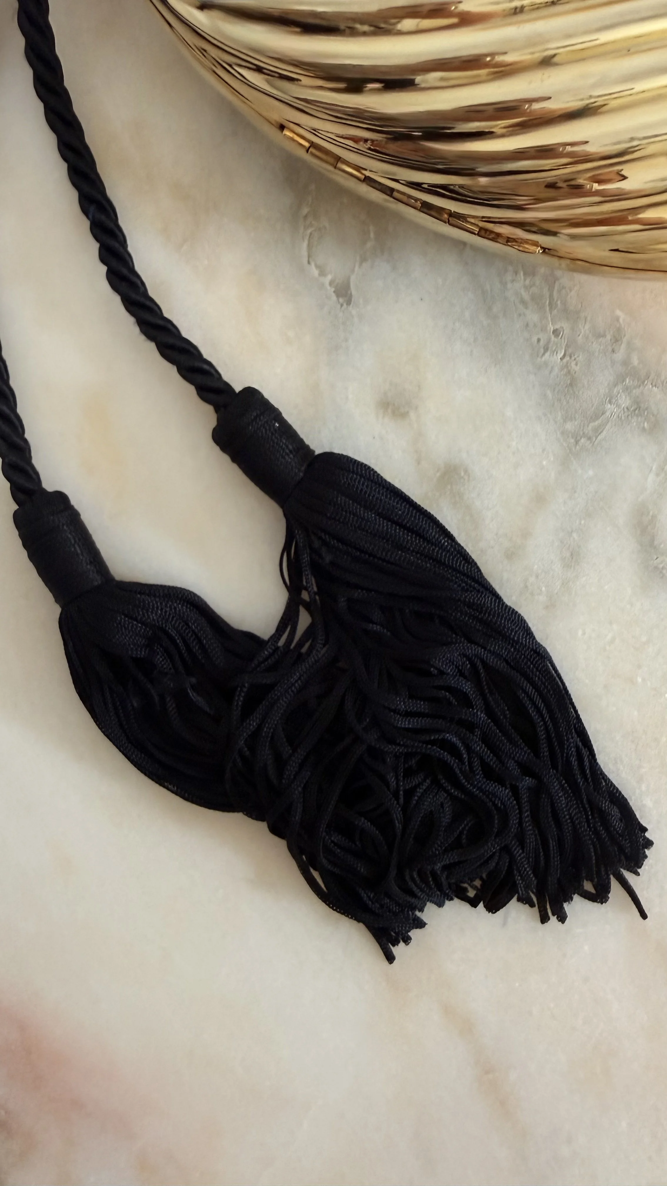 GOLD RIBBED EGG MINAUDIÈRE WITH TWO TASSELS 6.jpeg