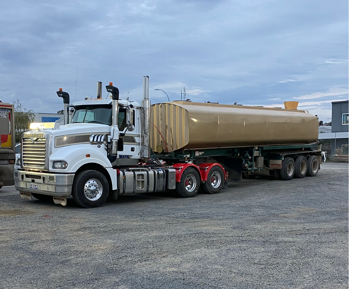 Mack water truck used for dust suppression, water cartage and site support on civil earthworks projects