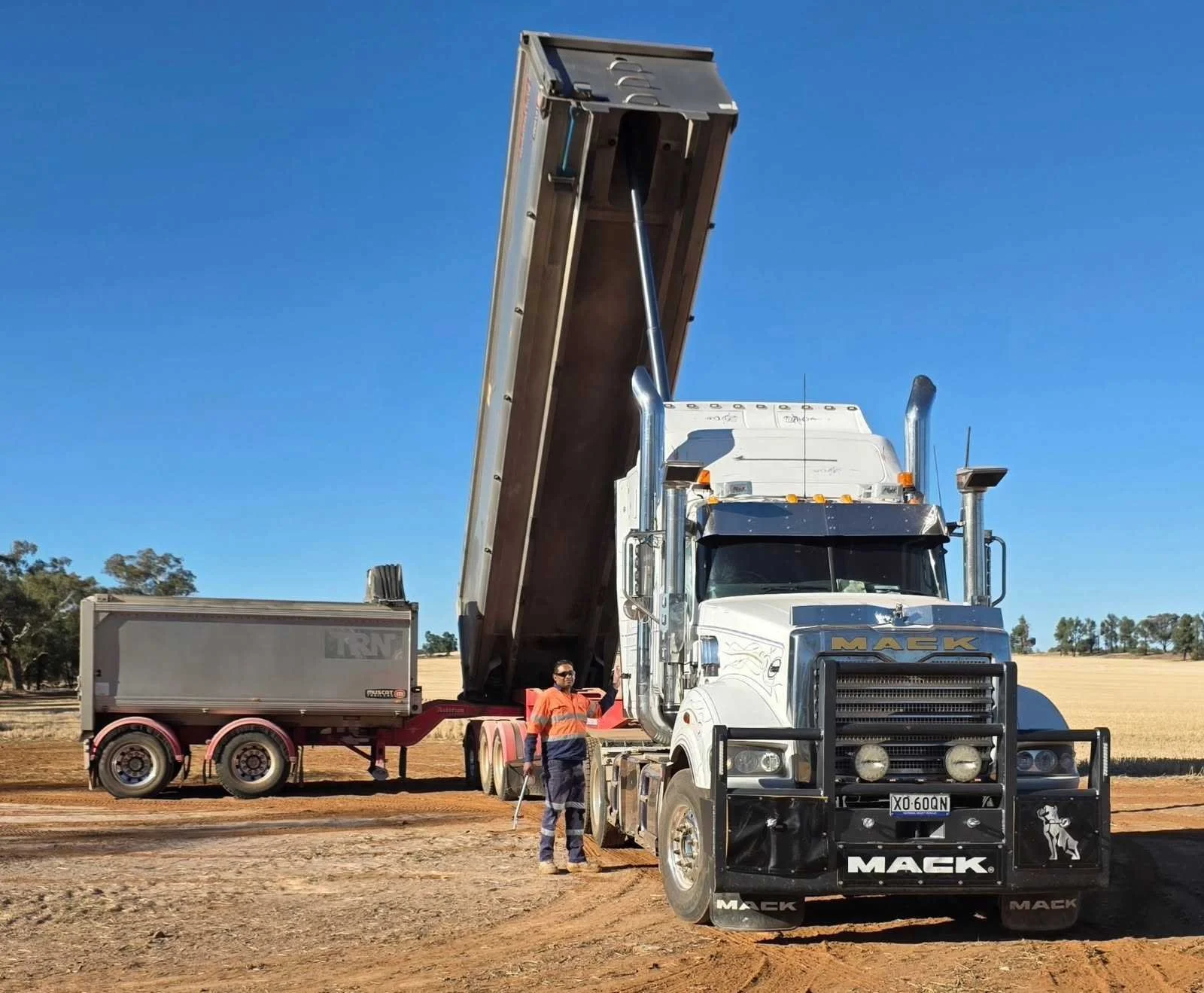 Truck fleet transporting bulk materials for construction projects, supporting site supply and logistics