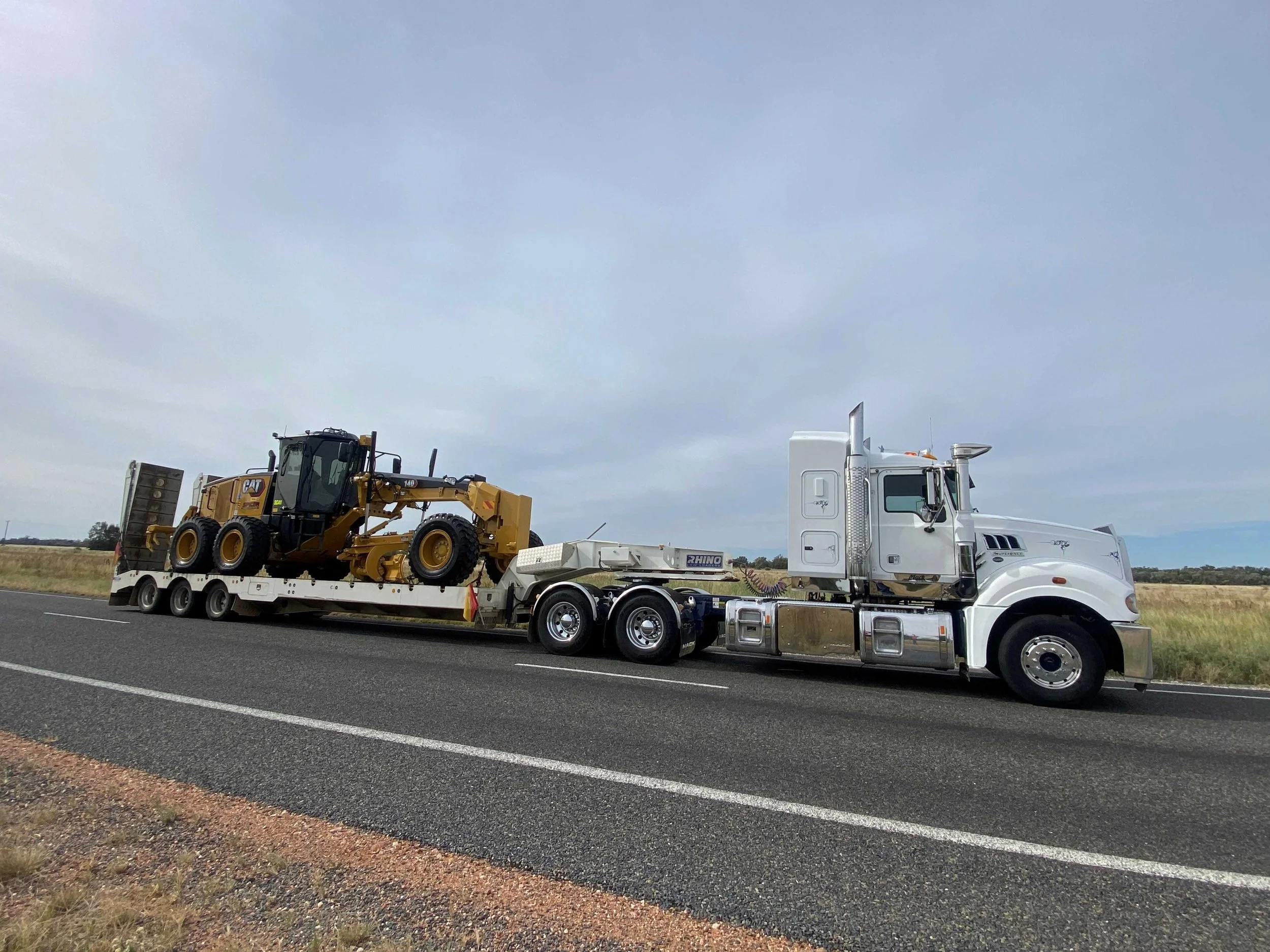 Heavy haulage transporting CAT equipment, supporting material supply and civil earthworks projects