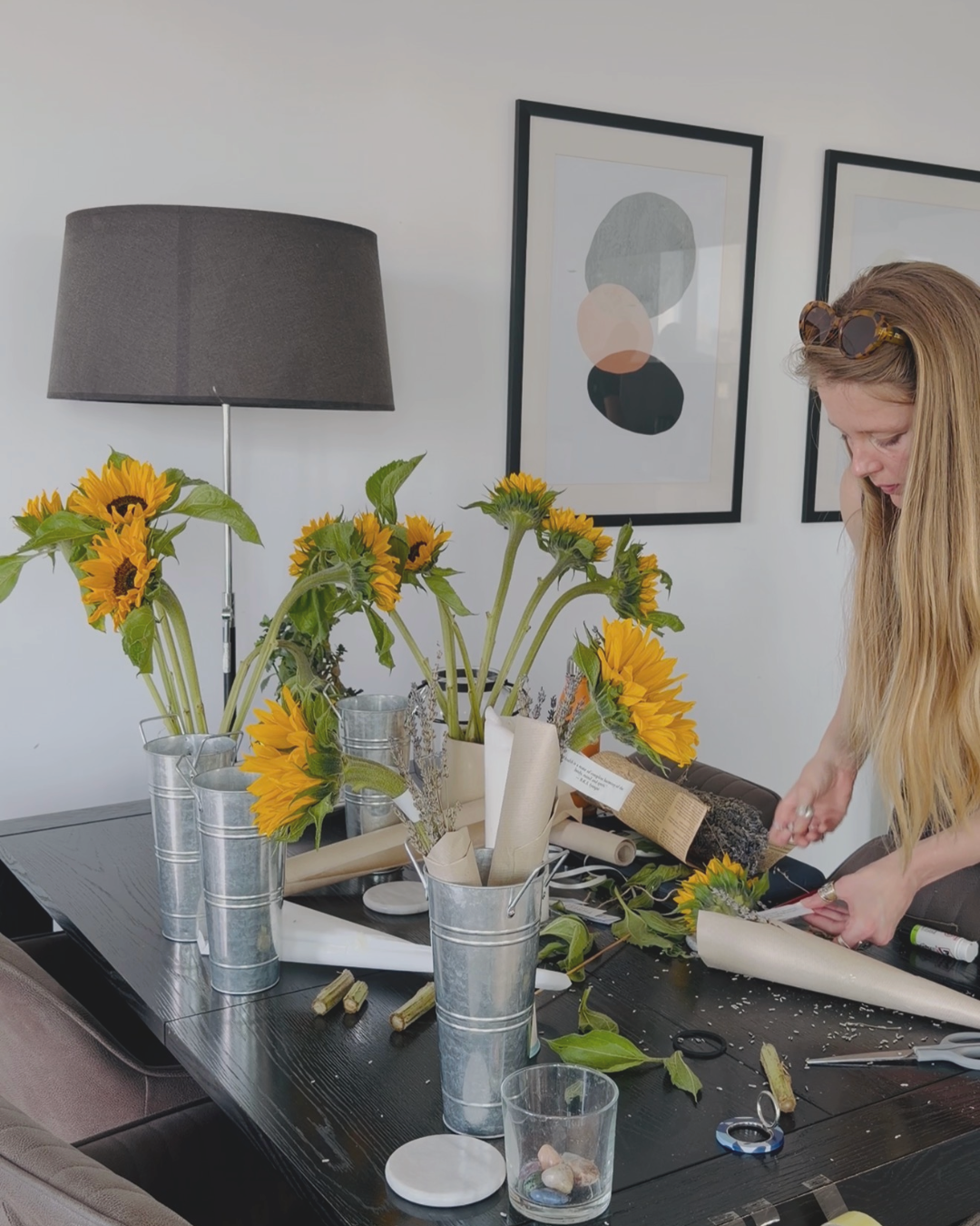 Author preparing flower arrangements for the Midsummer Renewal event at Pilates studio