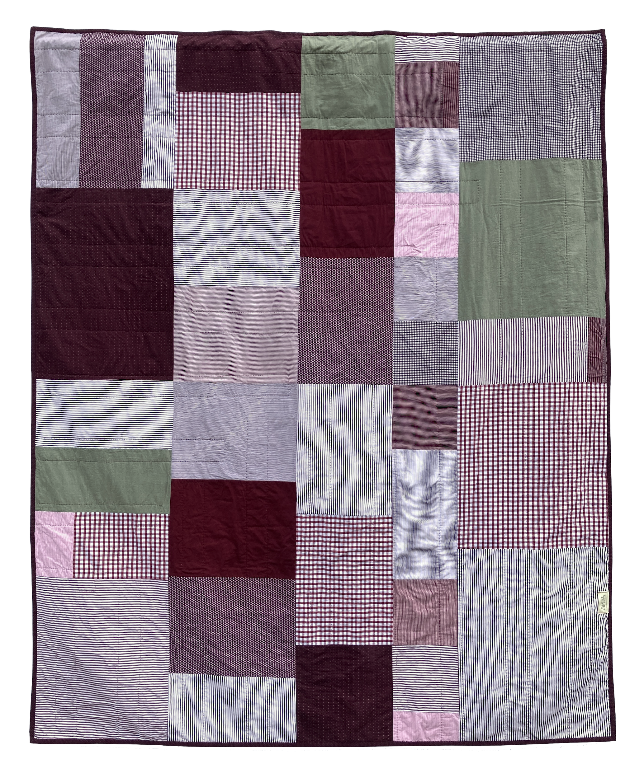 The back of of Sequoia, a hand stitched Blunt Objects patchwork quilt by designer maker Carolyn Thompson
