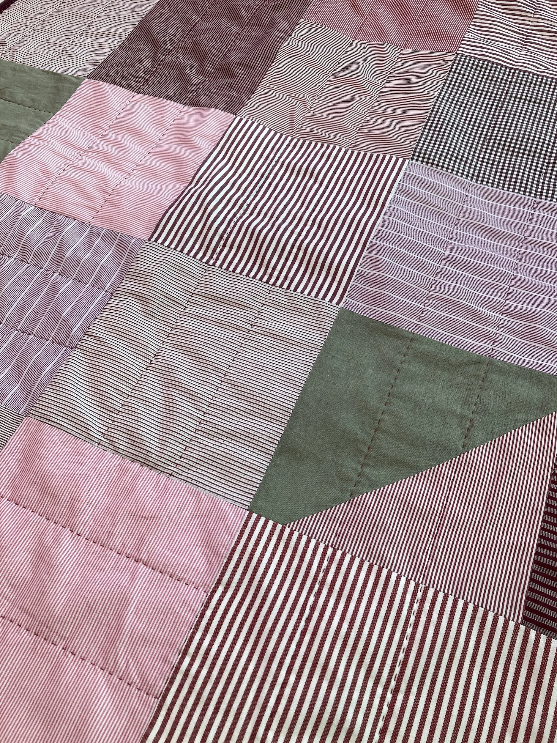A detail of Sequoia, a hand stitched Blunt Objects patchwork quilt by designer maker Carolyn Thompson