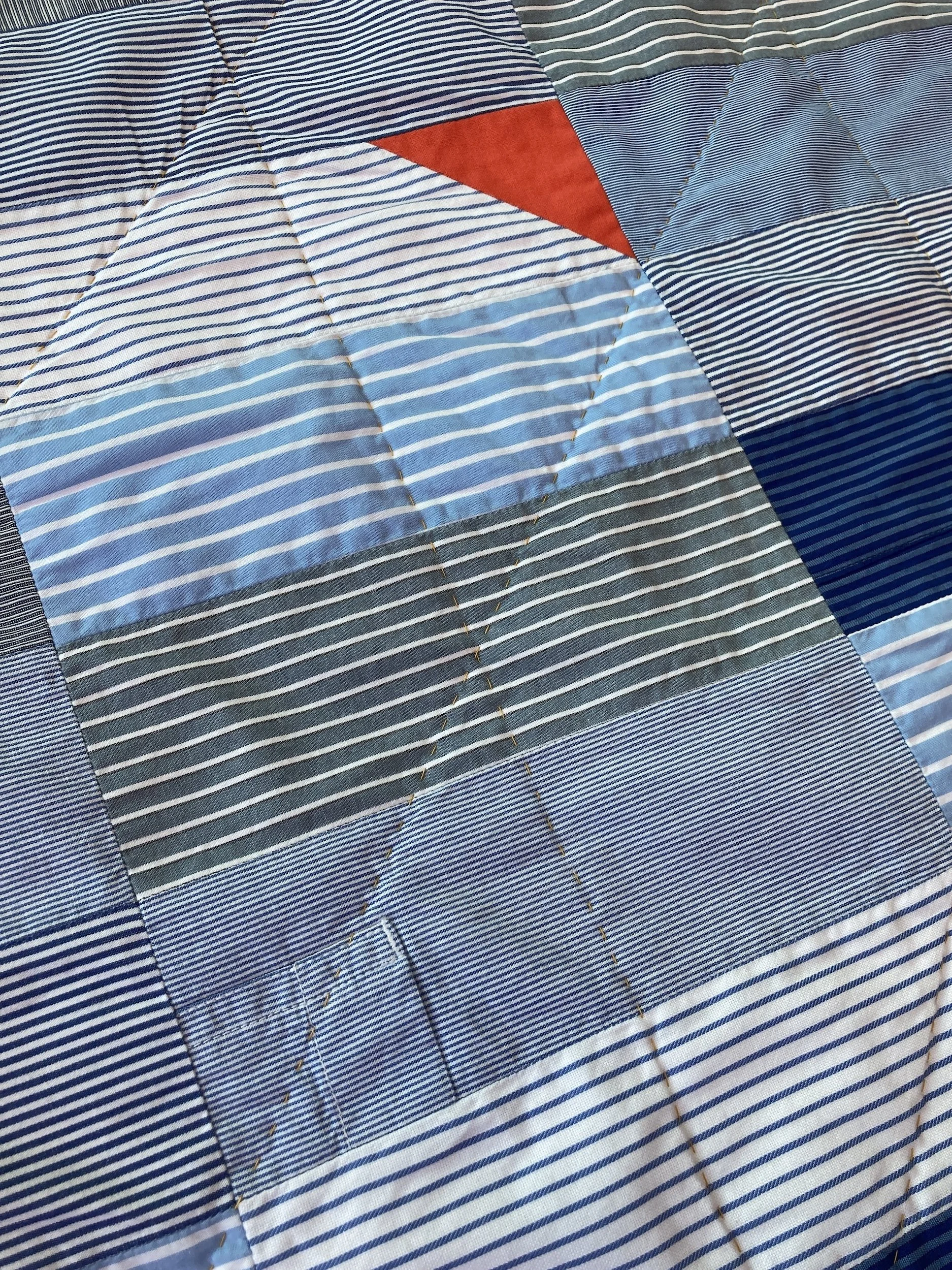 Frolic Quilt - A hand stitched Blunt Objects patchwork quilt by designer maker Carolyn Thompson