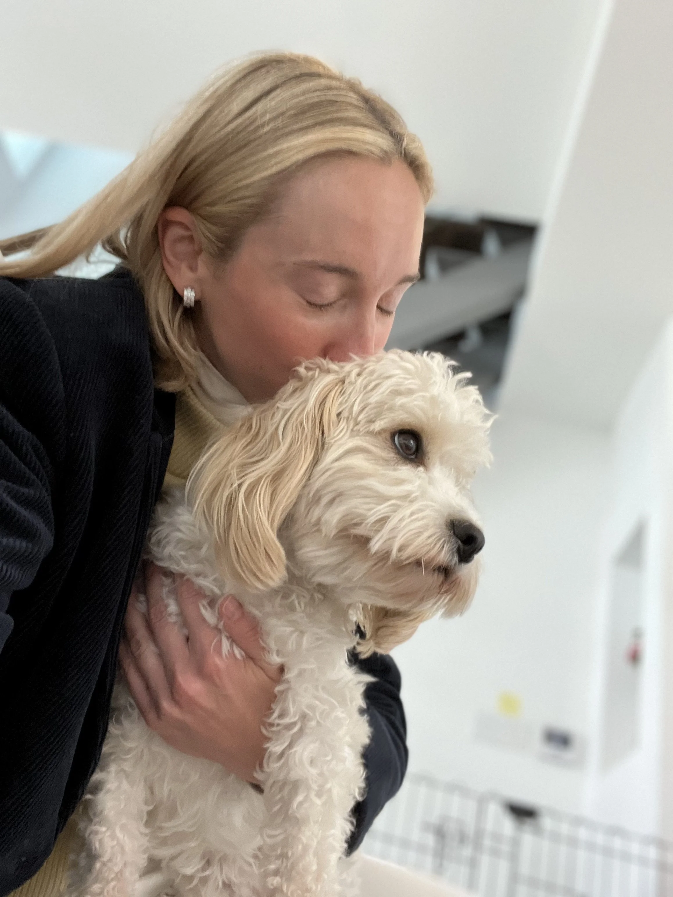 Woman and small white dog