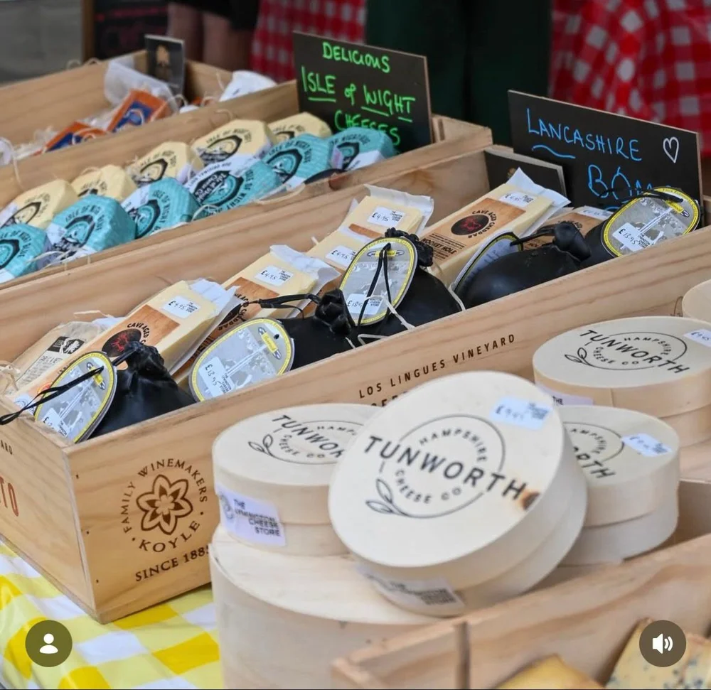 Cheeses ready on the market stall