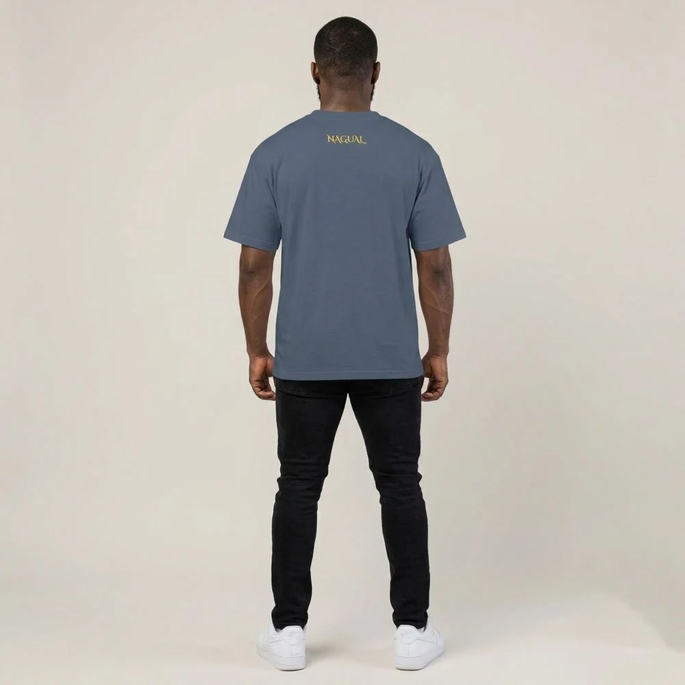 Back view of the tee from a distance, showing the oversized boxy fit and dropped shoulders
