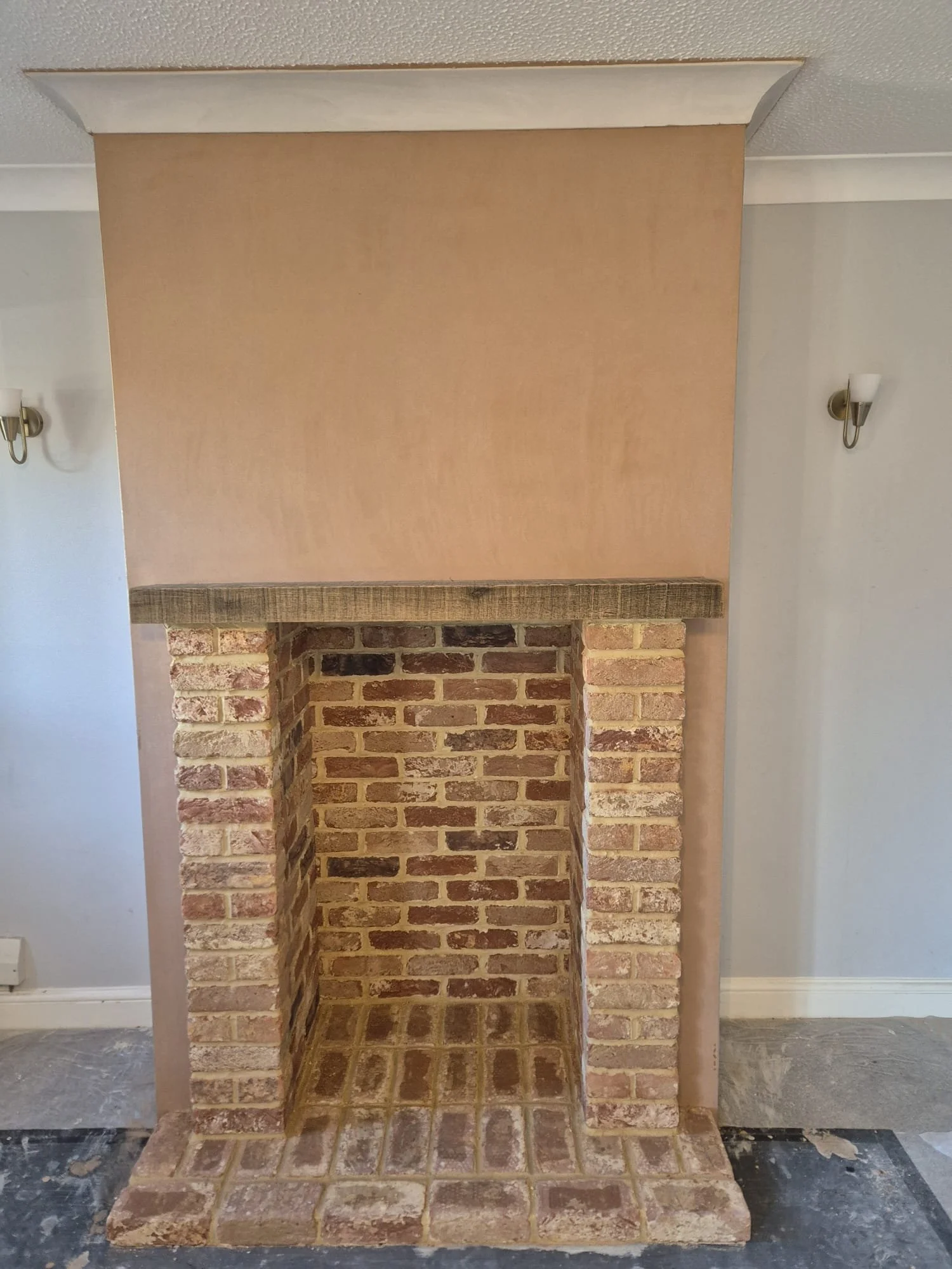 Reskimmed chimney breast, repaired cornice