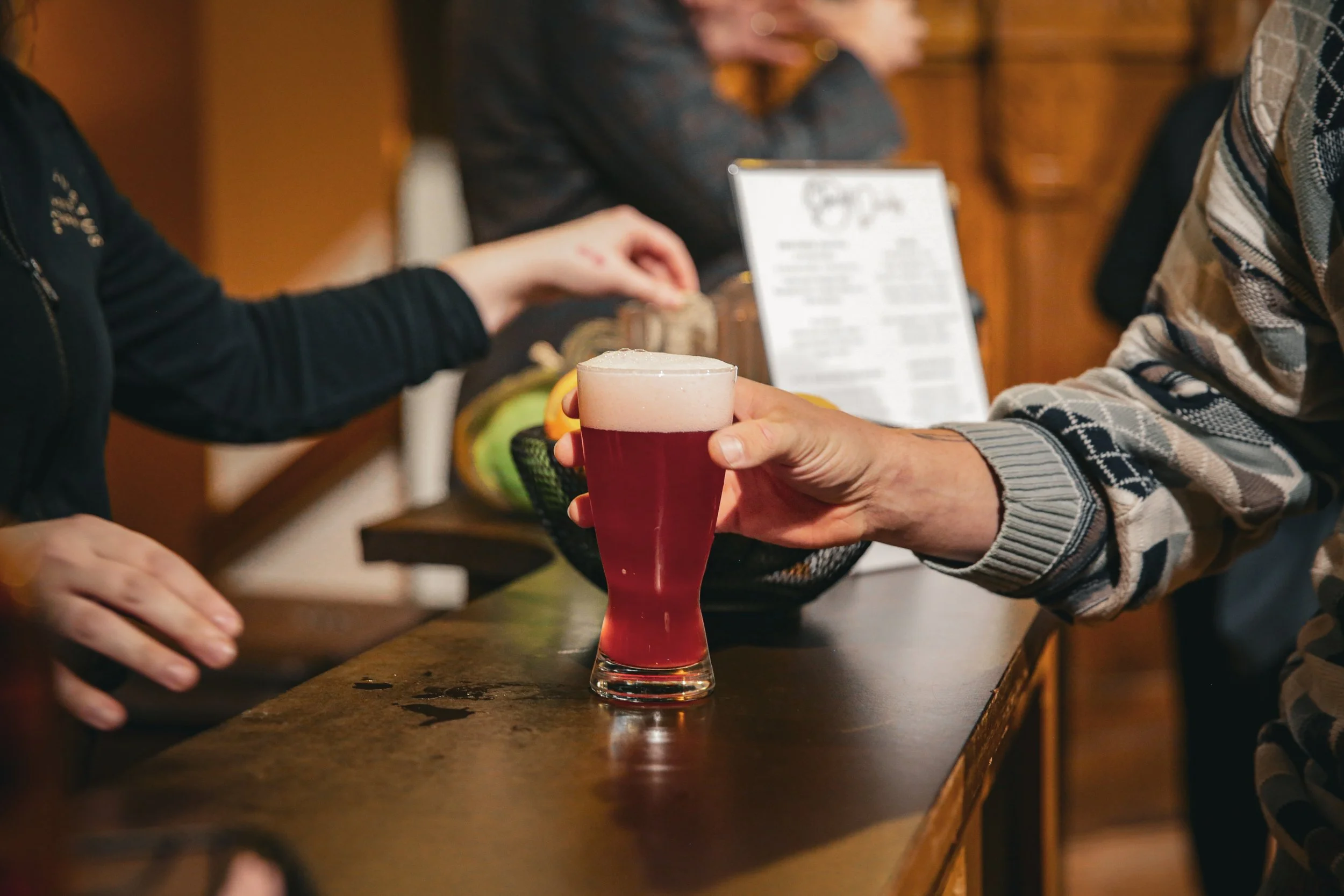 A glass of Hibiscus Raspberry Northstar Kombucha small-batch kombucha from Minneapolis on display at the Story Feast gathering at St. John's Abbey