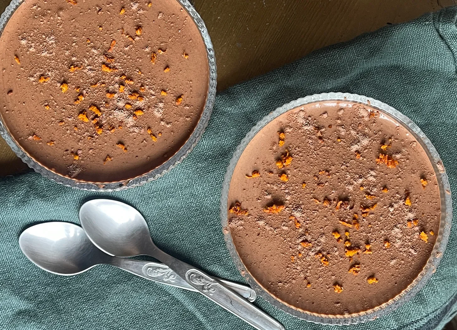 antoufle's Spiced Chocolate Mousse with Chili and Orange Zest served in individual glasses, dusted with cocoa powder and garnished with fresh orange zest