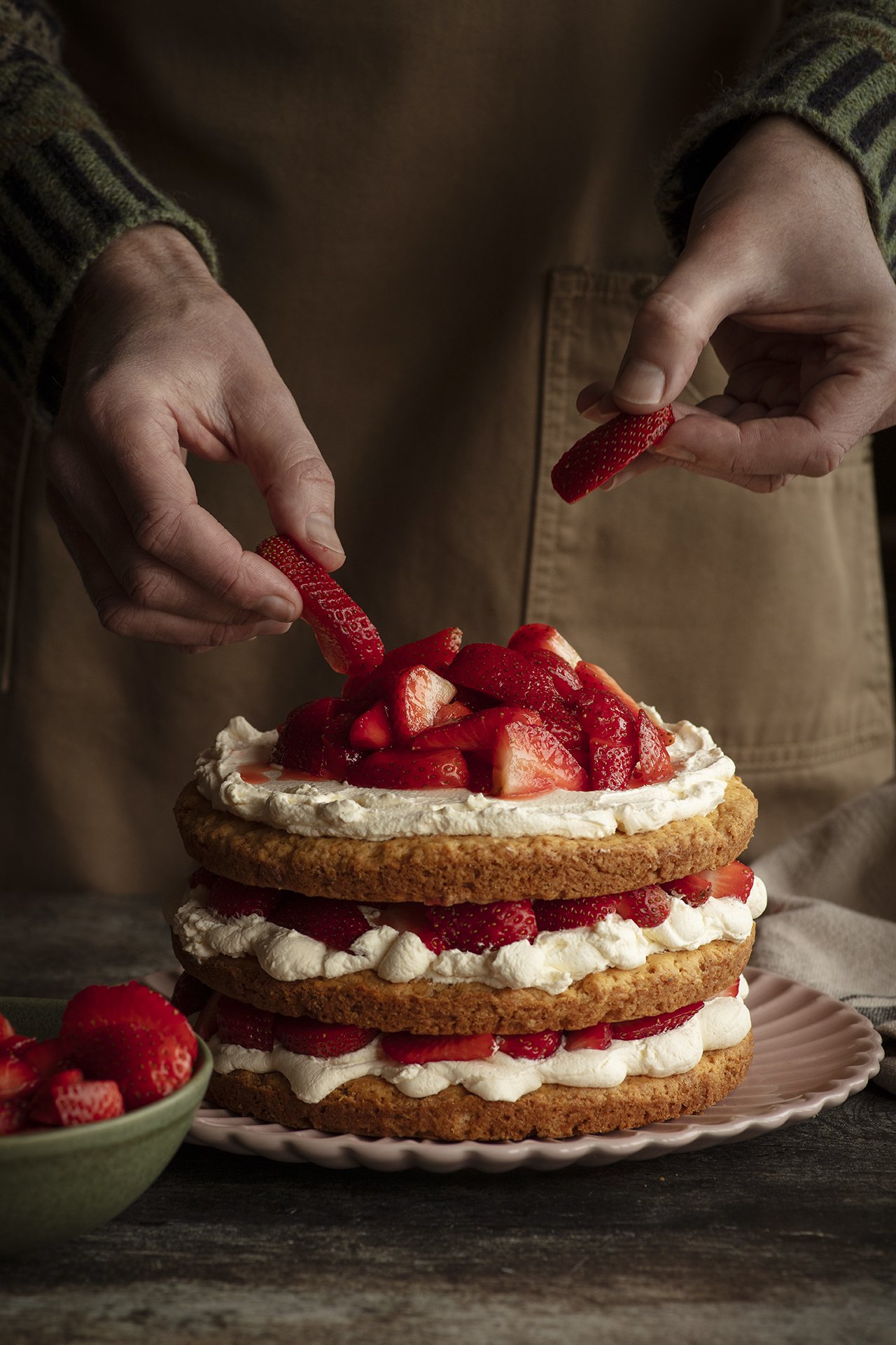 A photograph of a strawberry cake with whipped cream from Scottish photographer Susie Lowe, who will be a special guest at a cookbook workshop from James Beard nominated cookbook author Jody Eddy from Nov. 25th-27th at the Royal Society of Edinburgh
