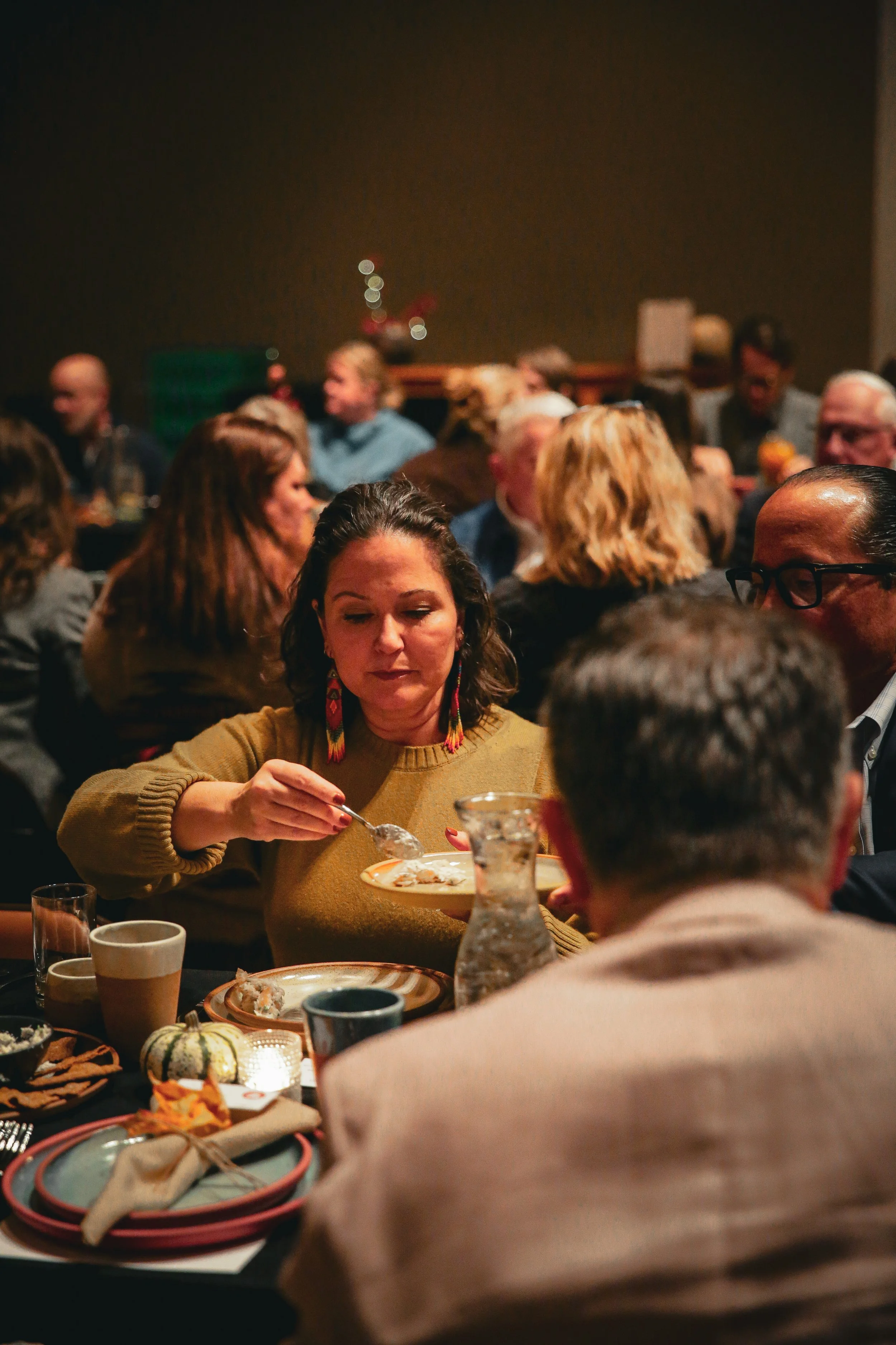 Community members connecting over food at Story Feast gathering