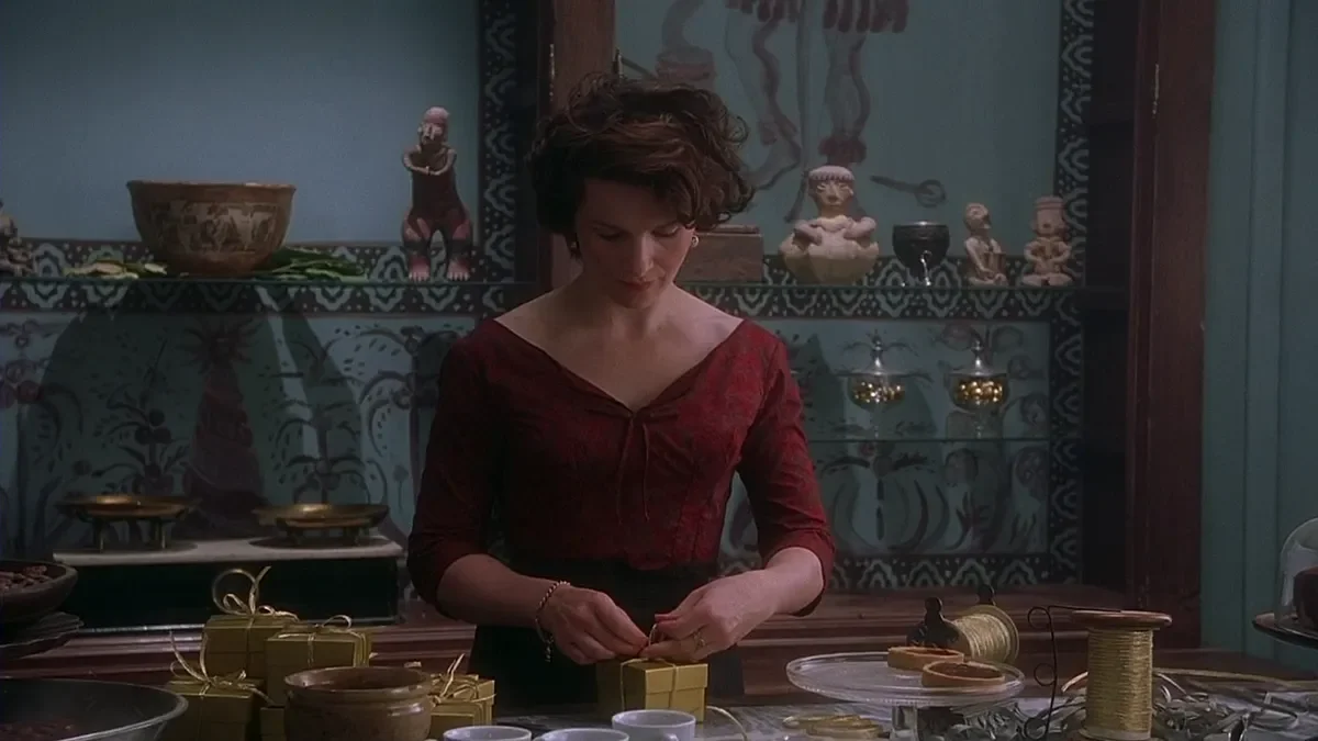 The chocolaterie from the movie Chocolat, with jewel-toned displays of handmade chocolates in a warmly lit French village shop. The  movie starred Juliette Binoche, Dame Judi Dench and Johnny Depp