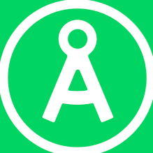 Billedet viser et grønt cirkelformet skilt med en hvid kompas- eller vinkelmåler-ikon i midten.