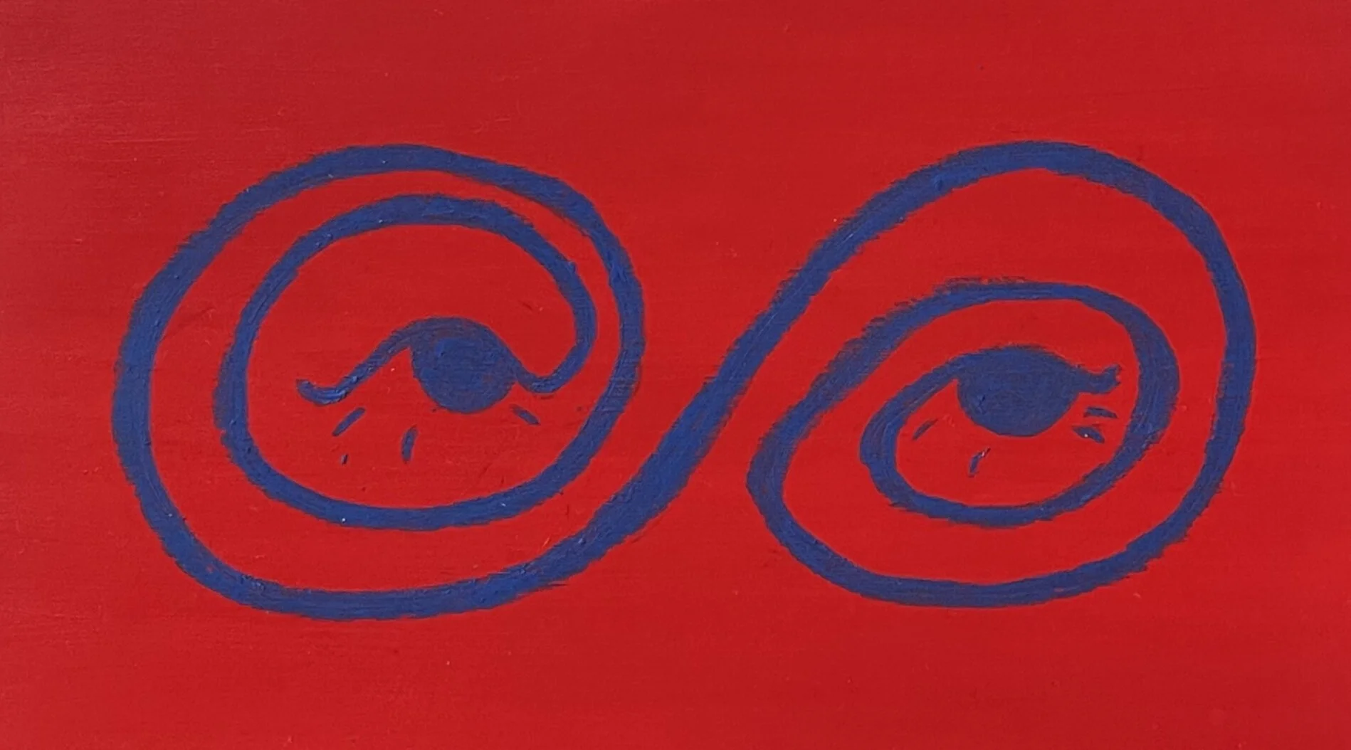 Blue spiral abstract eye pattern on a red background.