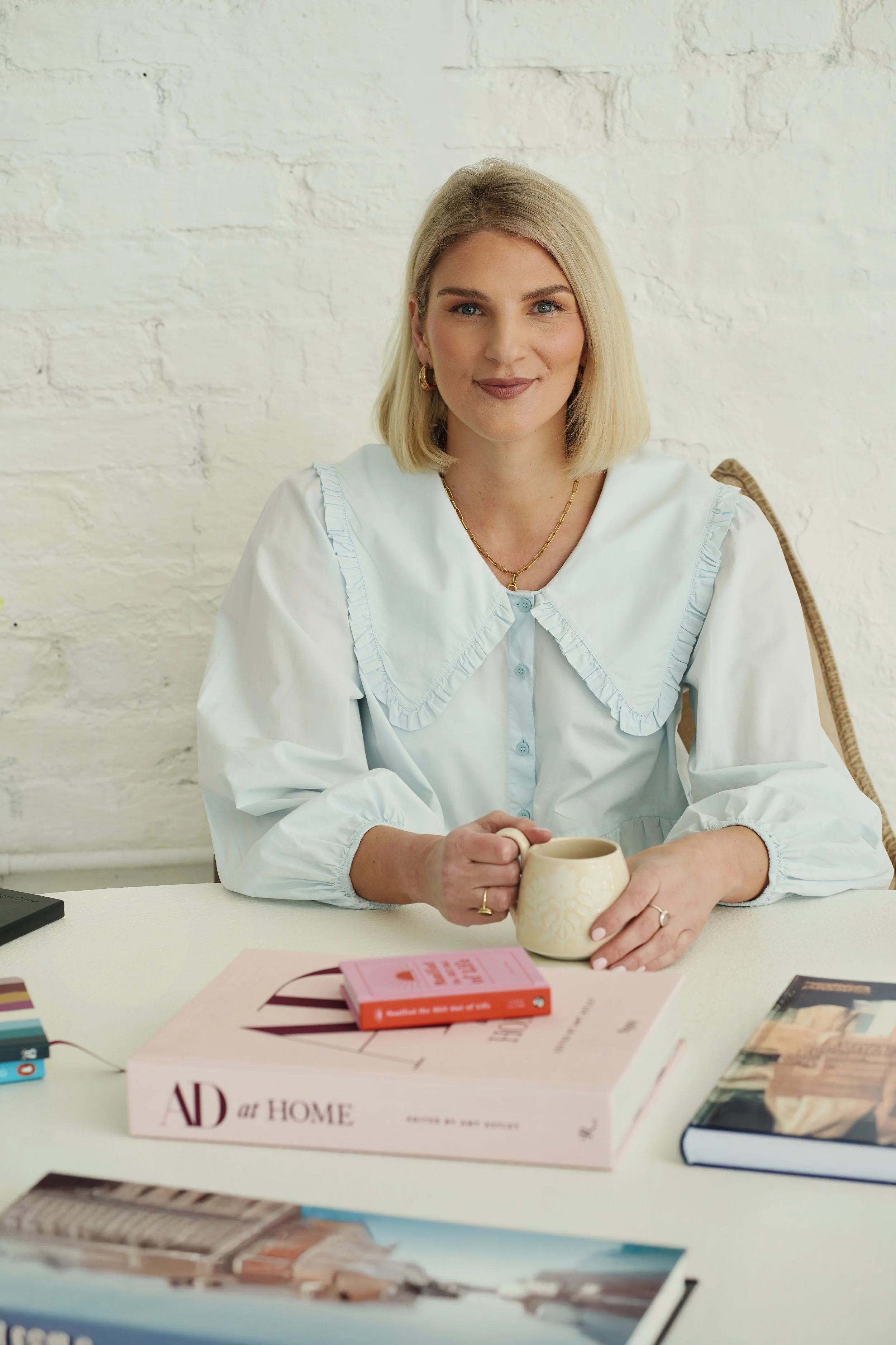 Sarah E Mold leadership coach, seated at desk