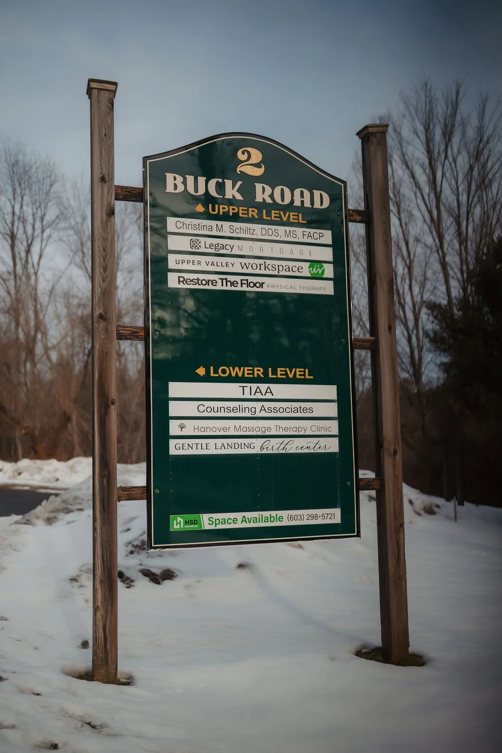Signboard for Buck Road, showing upper level and lower level tenants, including Christina M. Schiltz DDS, Legacy Mortgage, UPPER VALLEY workspace, Restore The Floor, TIA Counseling Associates, Hanover Massage Therapy Clinic, and GENTLE LANDING birth 