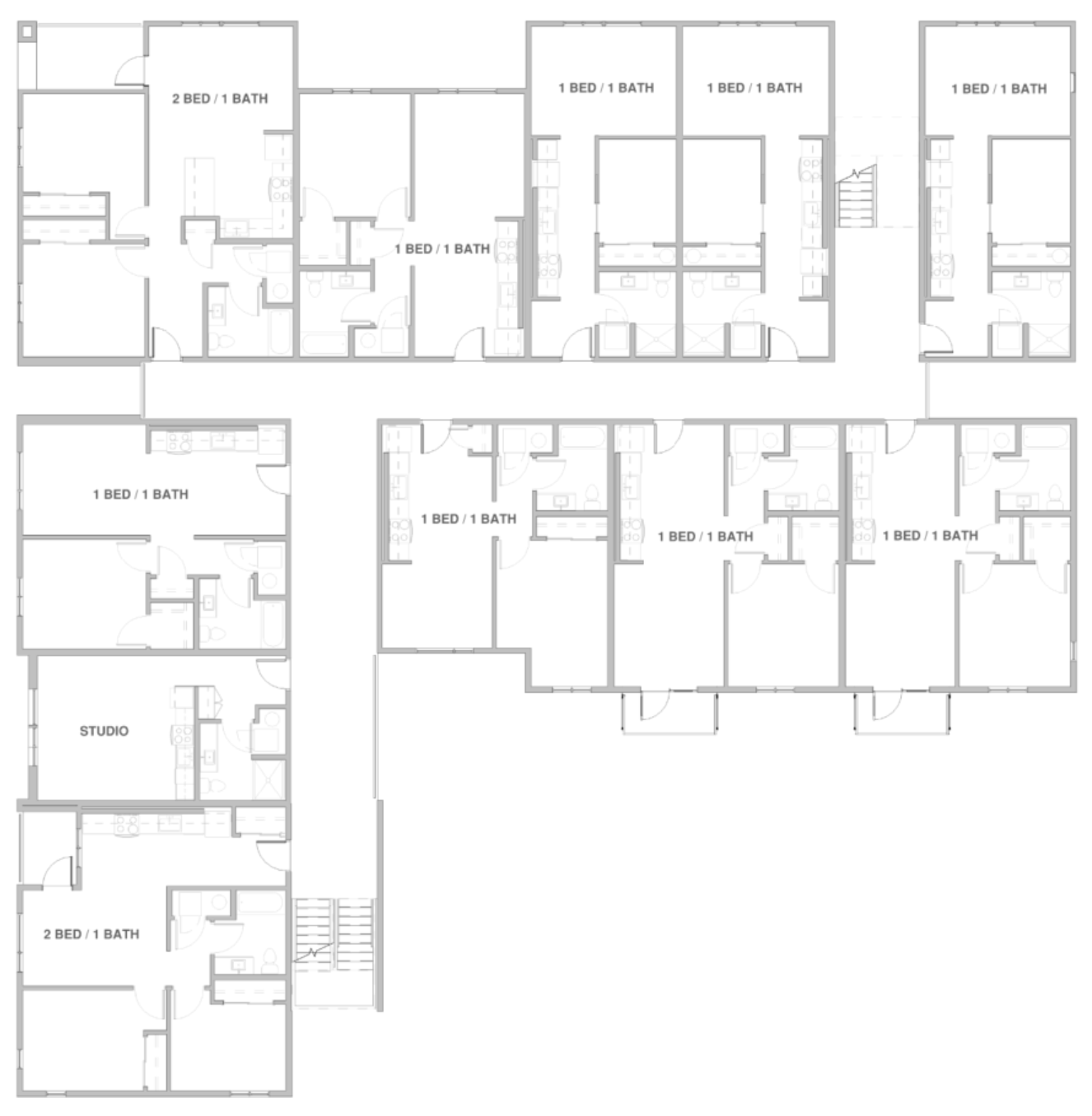 Floor plan of an apartment complex showing multiple one-bedroom, one-bath units, two-bedroom, one-bath units, and a studio apartment, with hallways, staircases, and layout details.