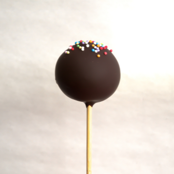 Chocolate cake pop with colorful sprinkles on top