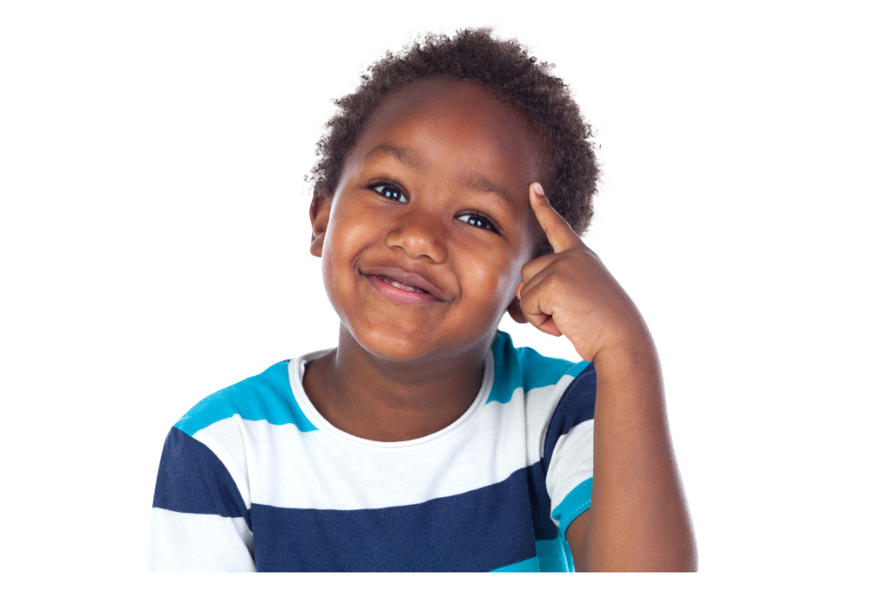 Young smiling boy with curly hair wearing a blue and white striped shirt, pointing to his temple, against a white background.