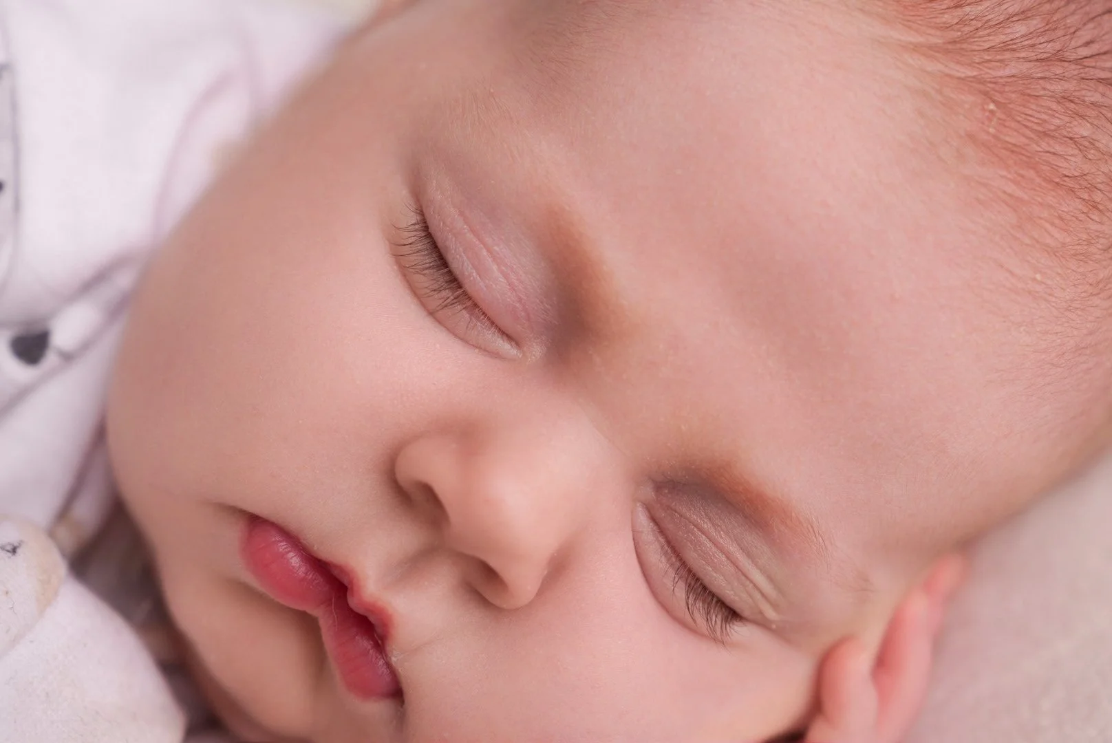 Group of young girls performing a dance on stage for a 'Planet Party' event, wearing red and white jackets with camo pants, under colorful stage lighting.