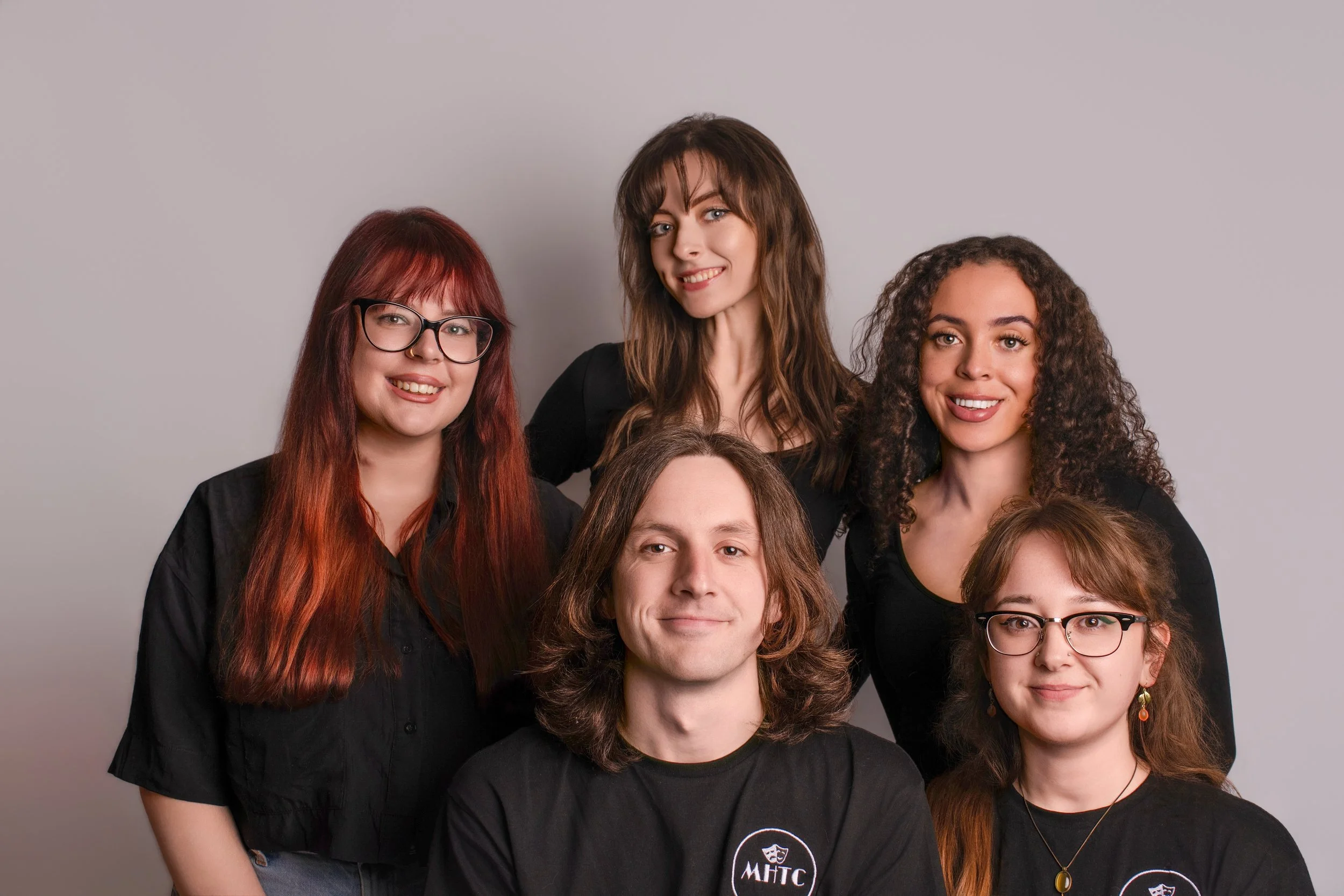 Professional headshot of creative business owner with natural light background