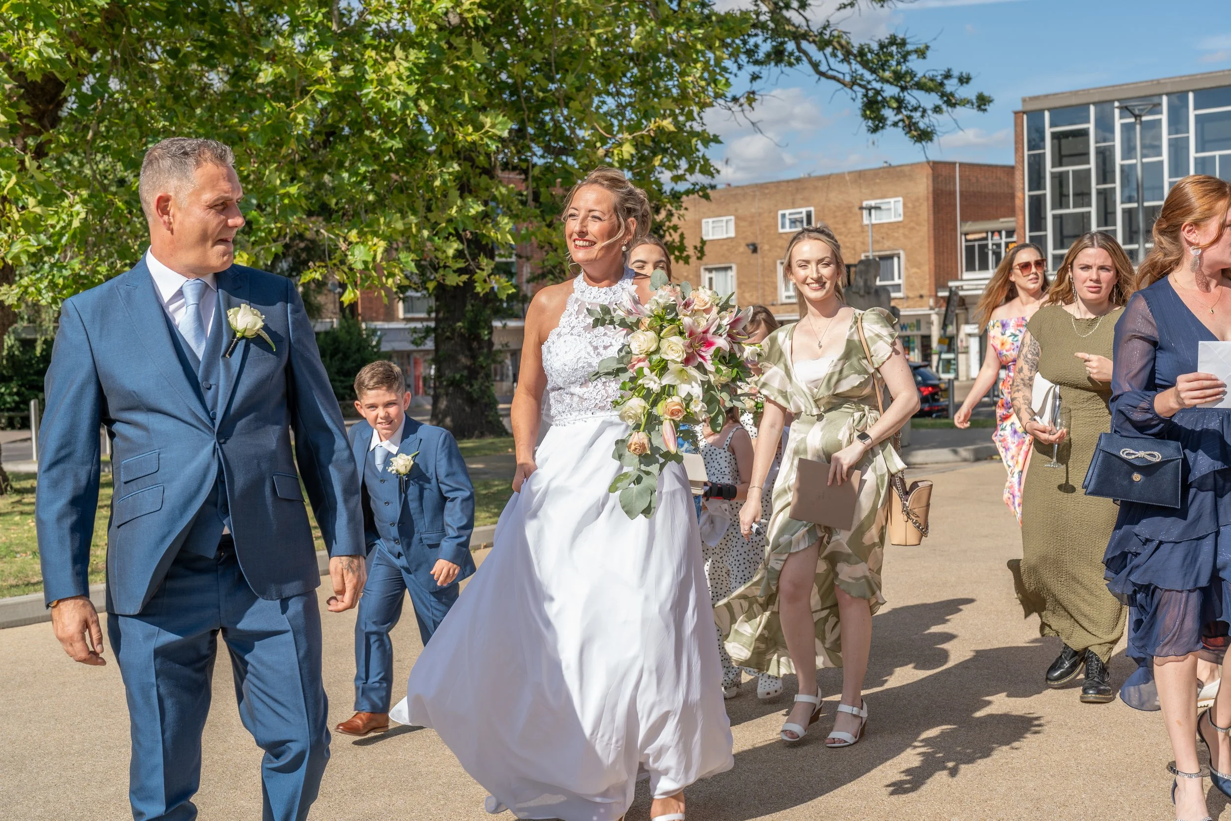 a-bride-and-groom-walking-down-the-street.jpg