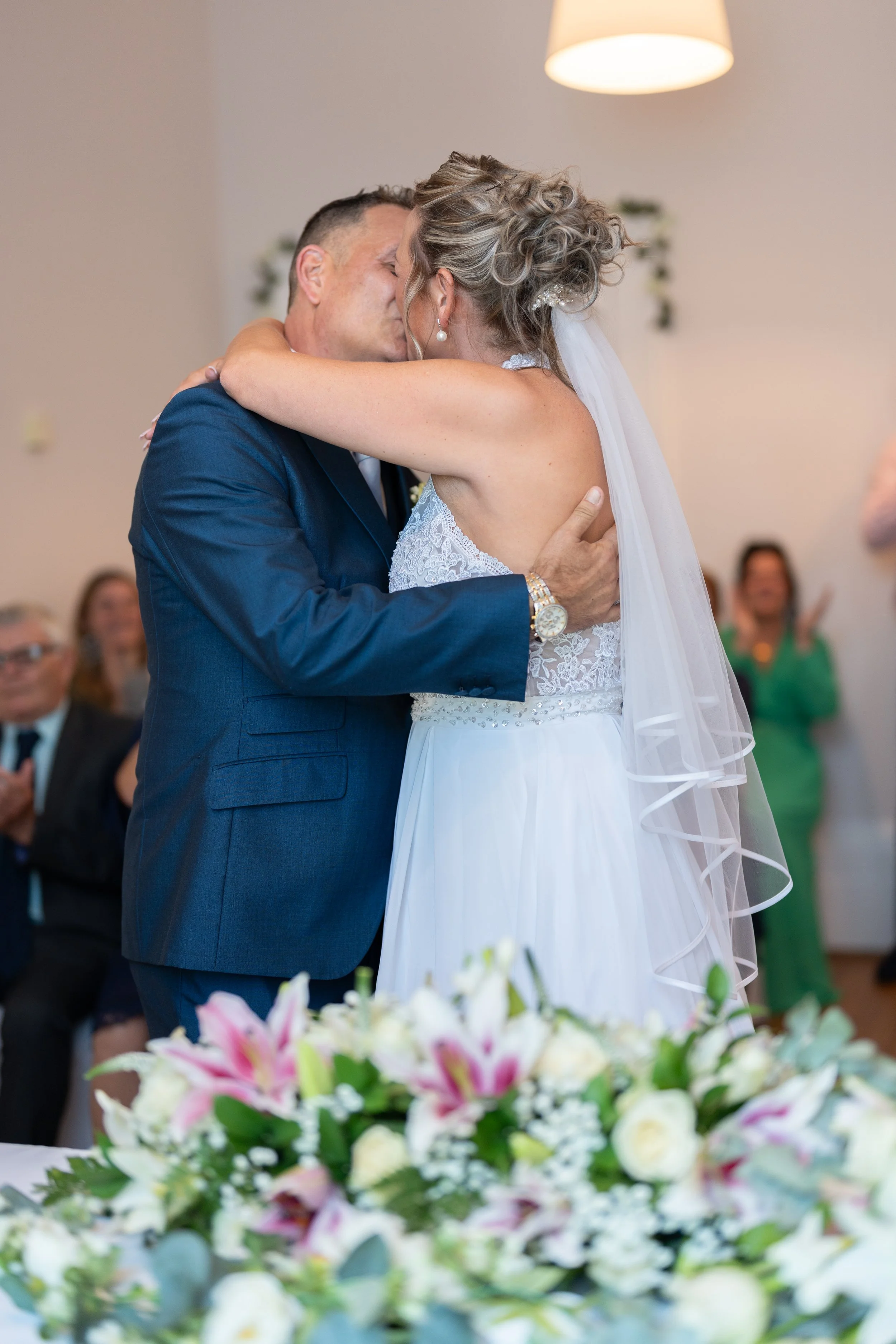 a-bride-and-groom-sharing-a-kiss-at-their-wedding.jpg