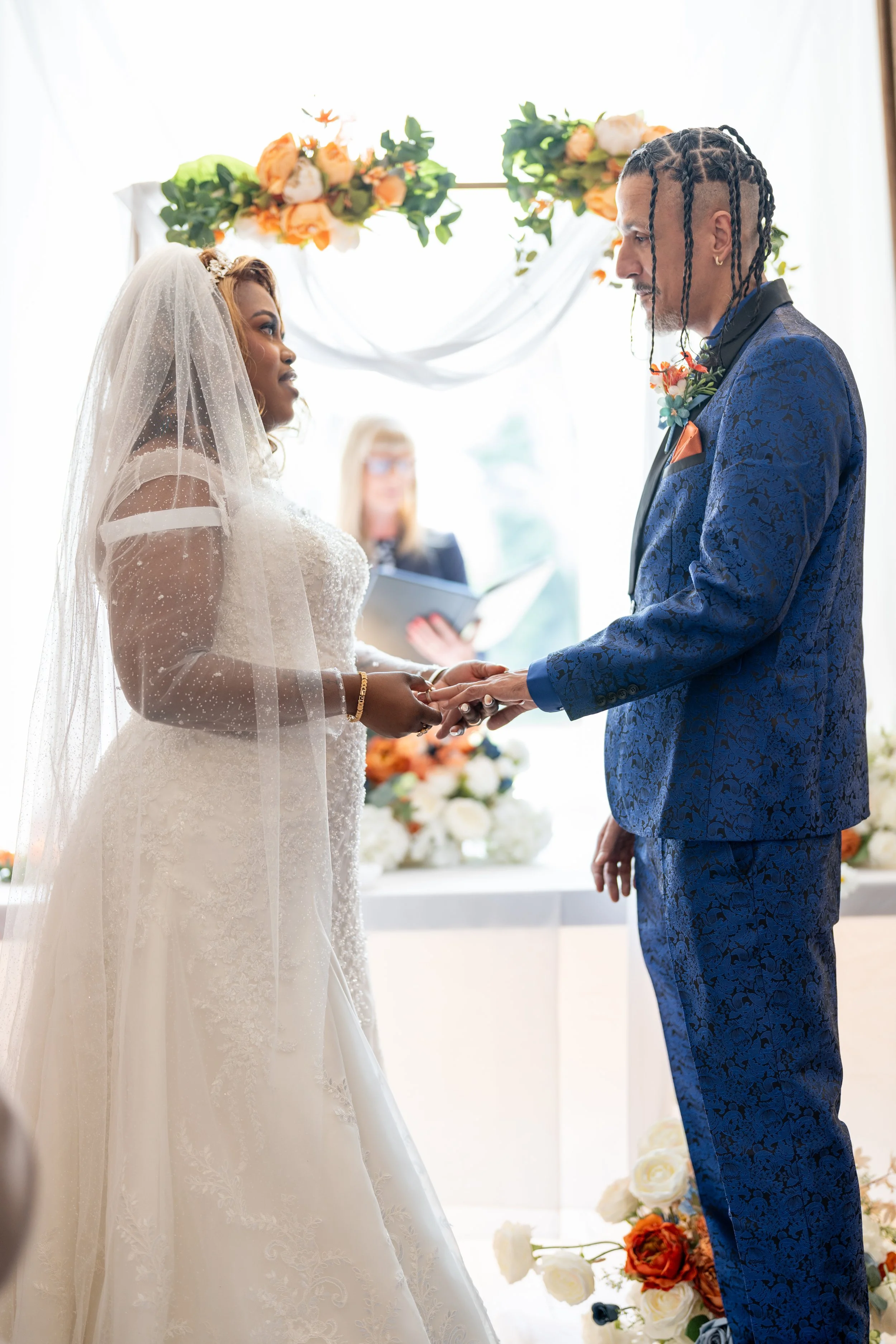 a-man-and-woman-are-exchanging-a-wedding-ring-2.jpg