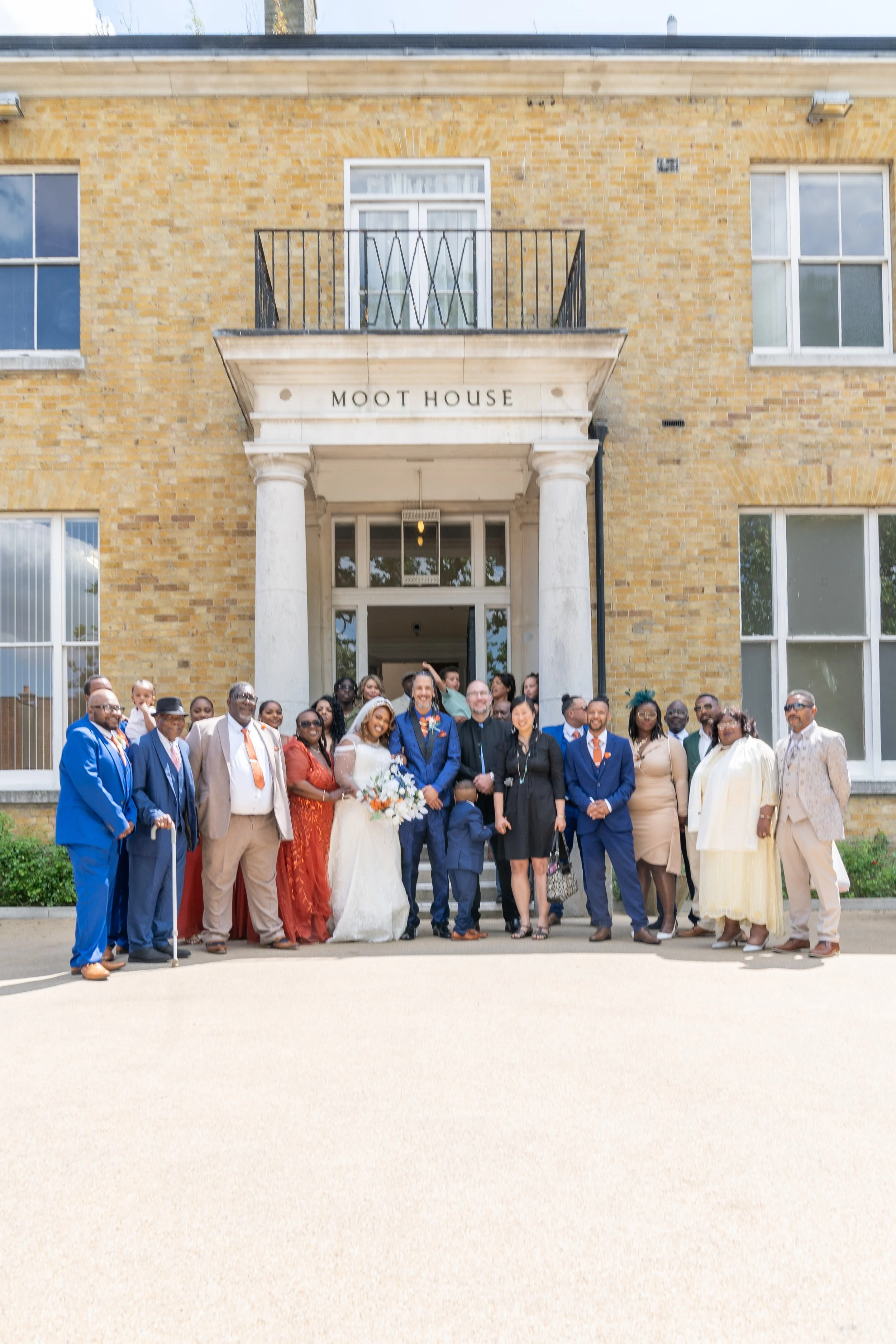 a-group-of-people-standing-outside-of-a-building.jpg