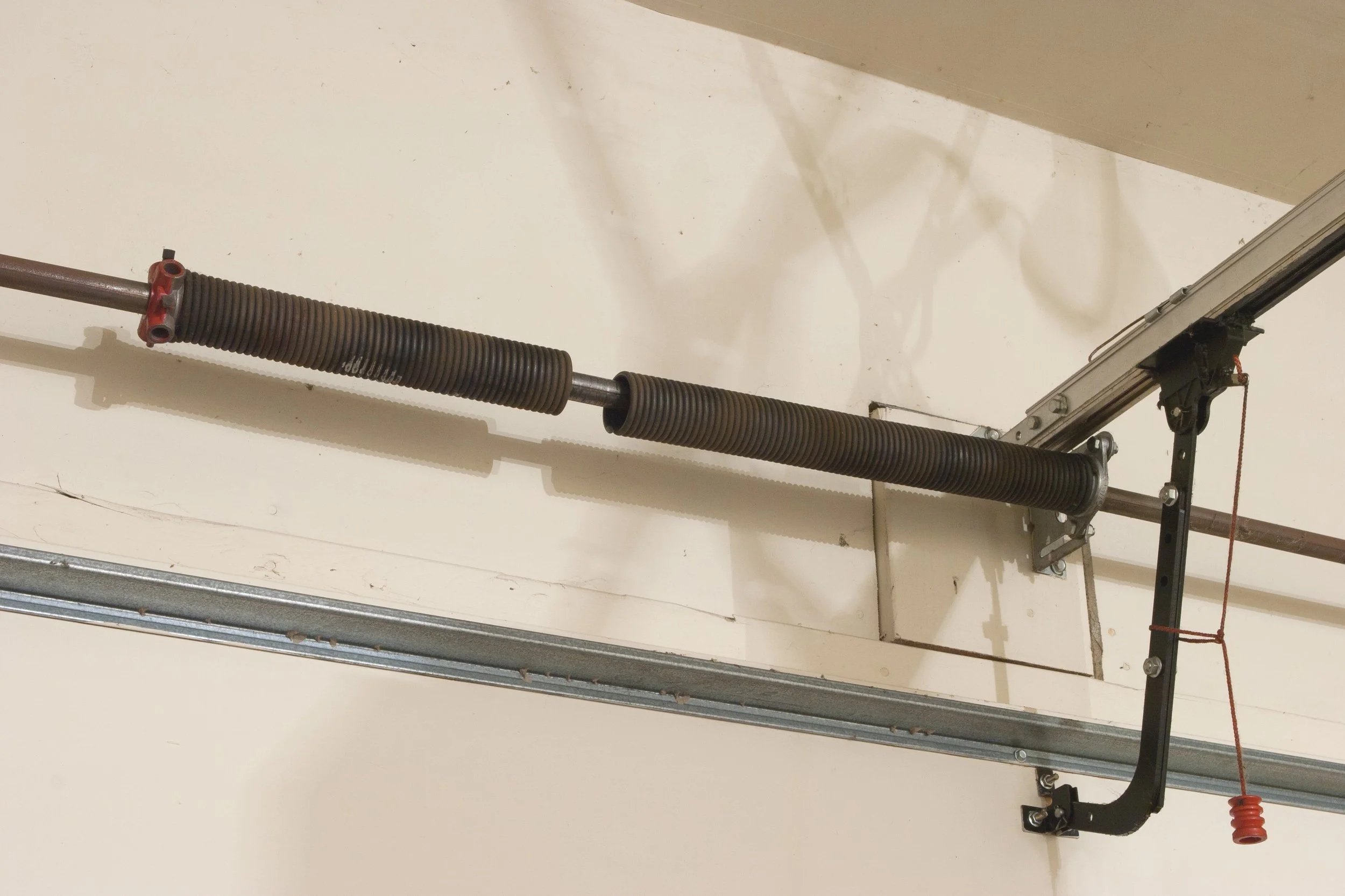 garage door broken spring, and spring replacement