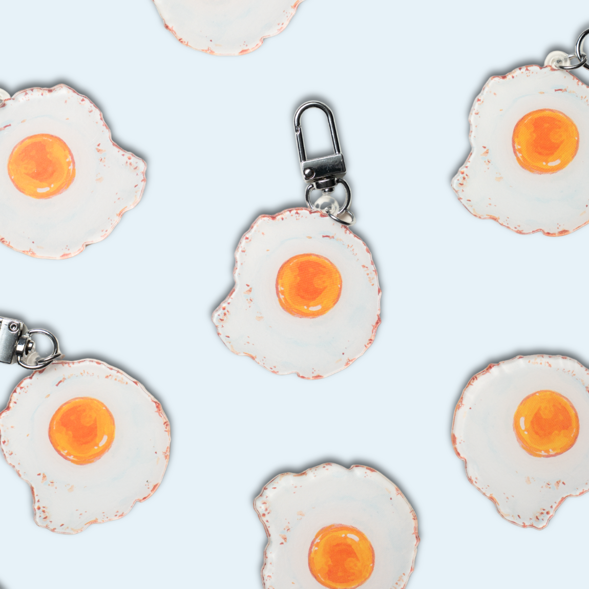 Studio Handog Fried Egg Acrylic Keychain Flat Lay.png