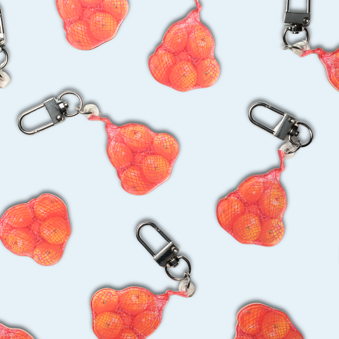Studio Handog Bag of Oranges Acrylic Keychain Flat Lay.png