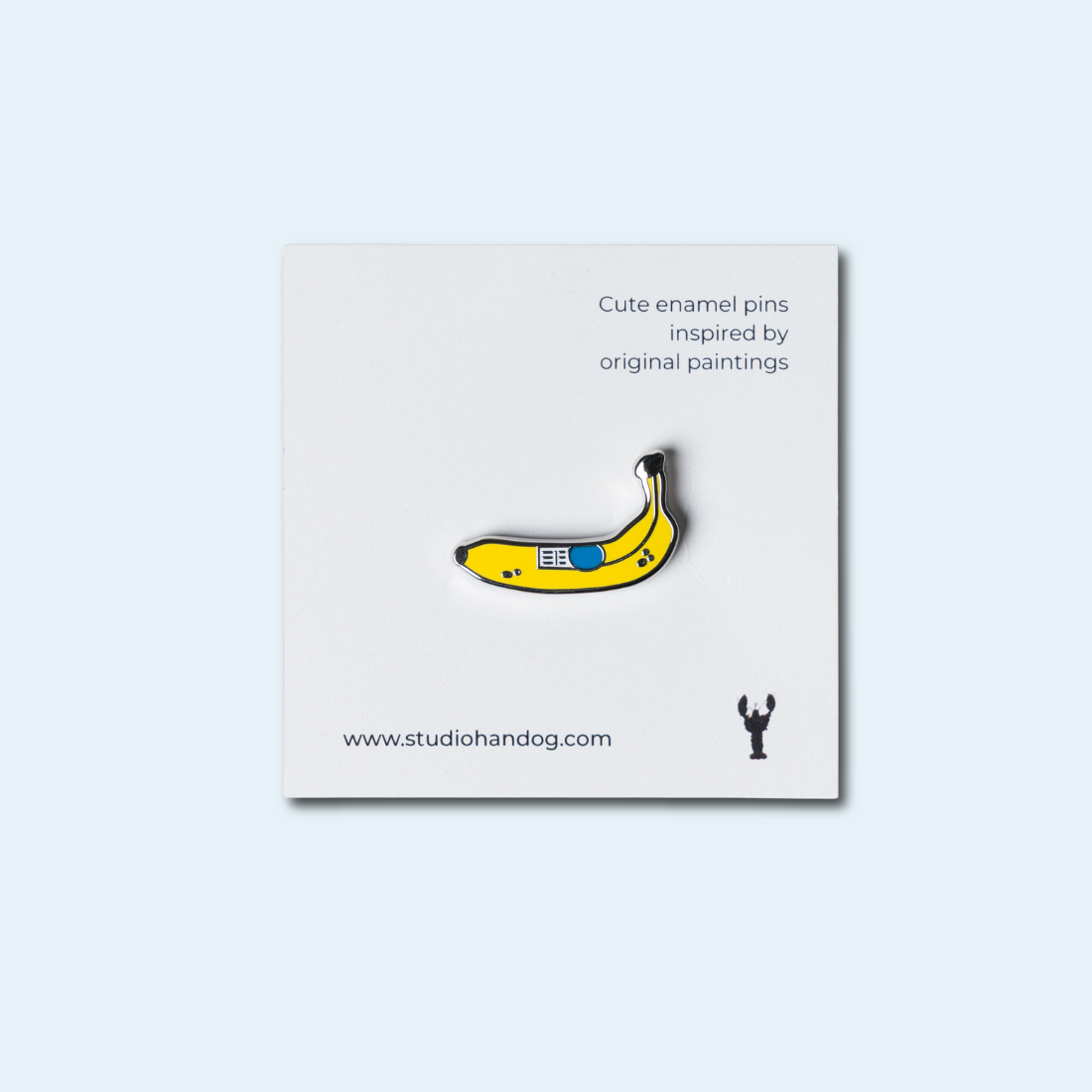 Studio Handog Banana Enamel Pin with backing.png