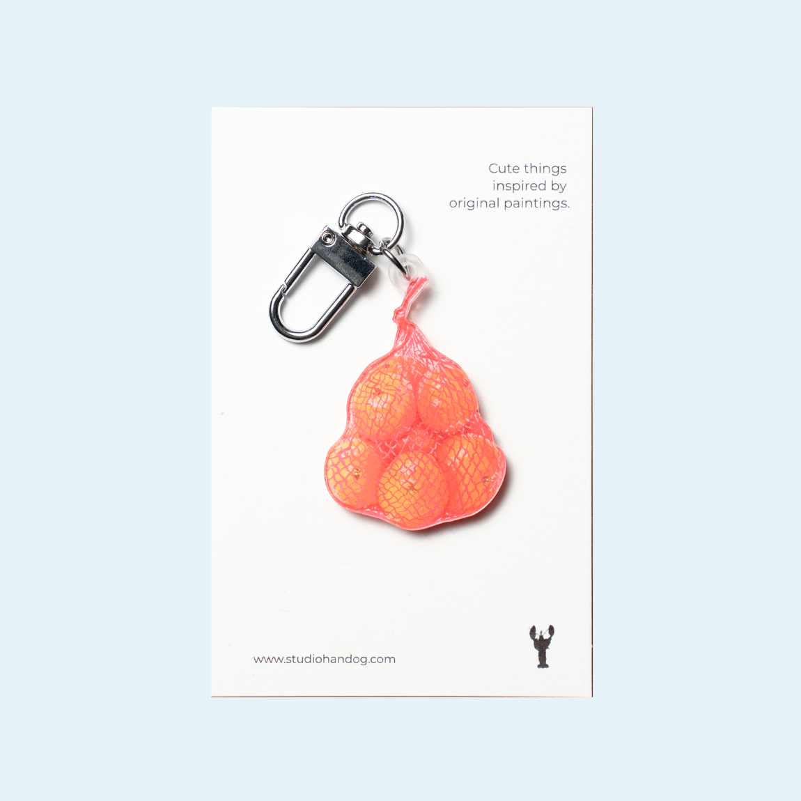 Studio Handog Bag of Oranges Acrylic Keychain with backing.png