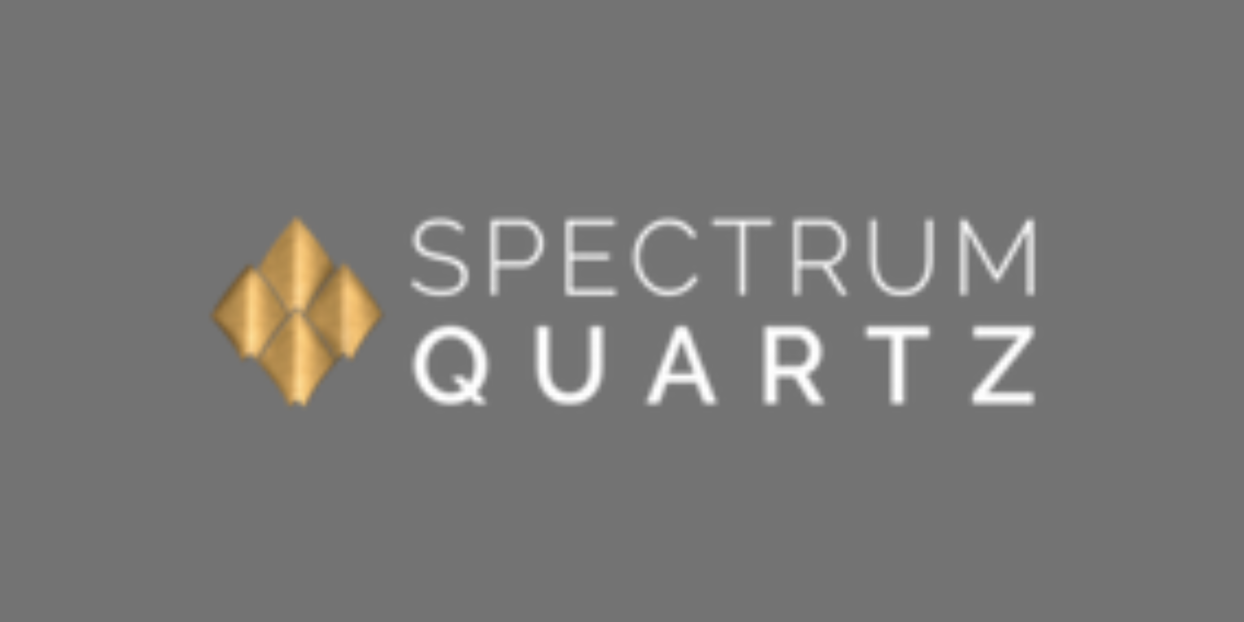 Spectum Quartz logo with gold diamond-shaped geometric design on gray background.