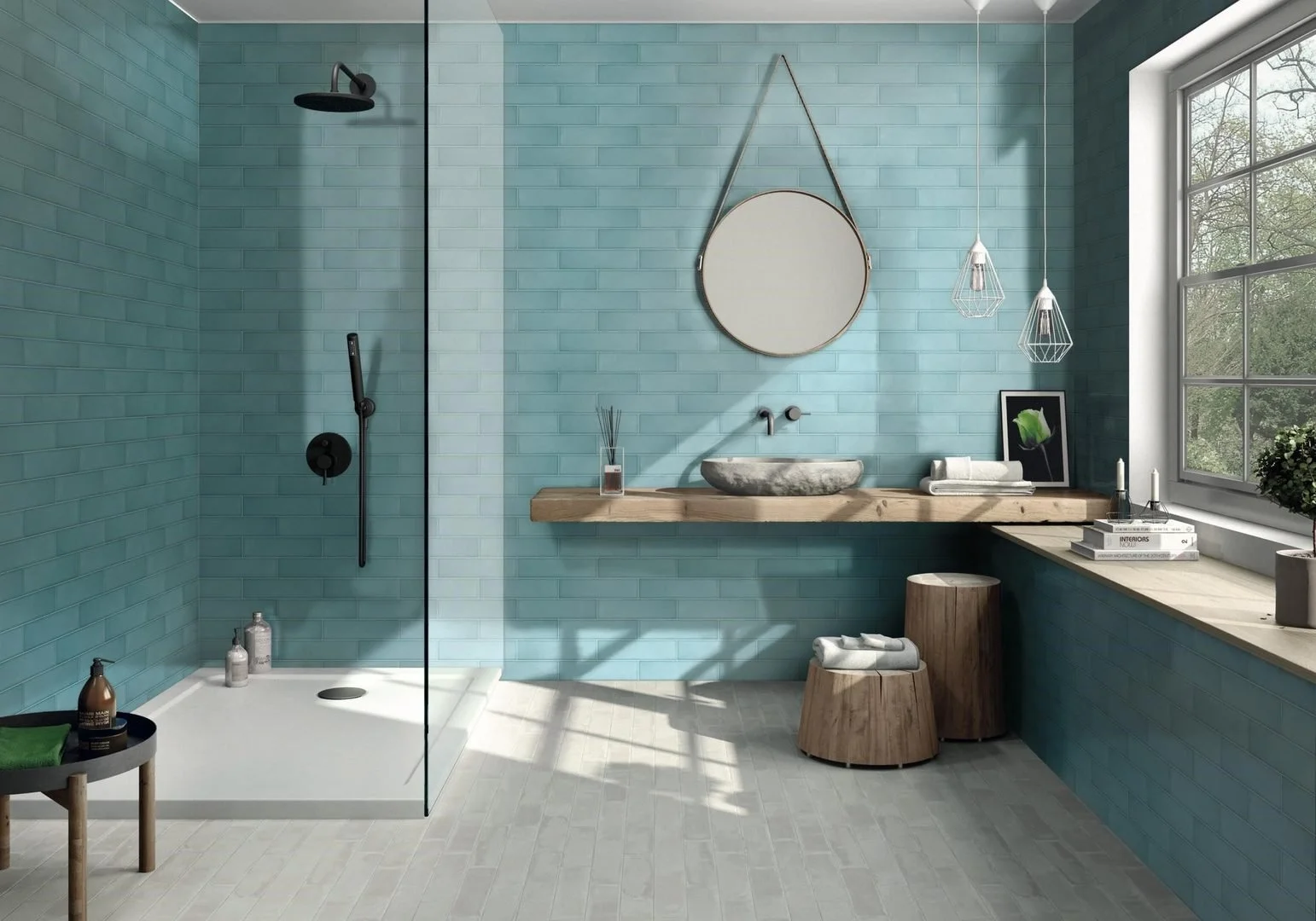Modern bathroom with a walk-in shower, a blue tiled wall, a large window, and a wooden vanity with a vessel sink and mirror.