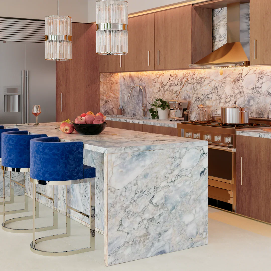 Modern kitchen with marble island, blue velvet bar stools, wooden cabinets, and marble backsplash, with pendant lighting and stainless steel appliances.