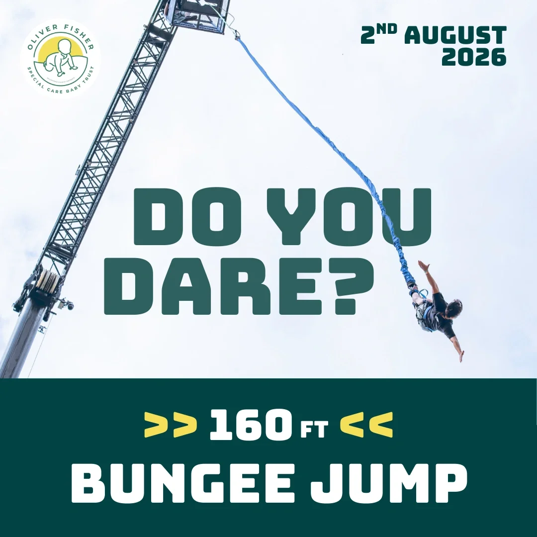 Person mid air during high bungee jump attached to crane over an outdoor location