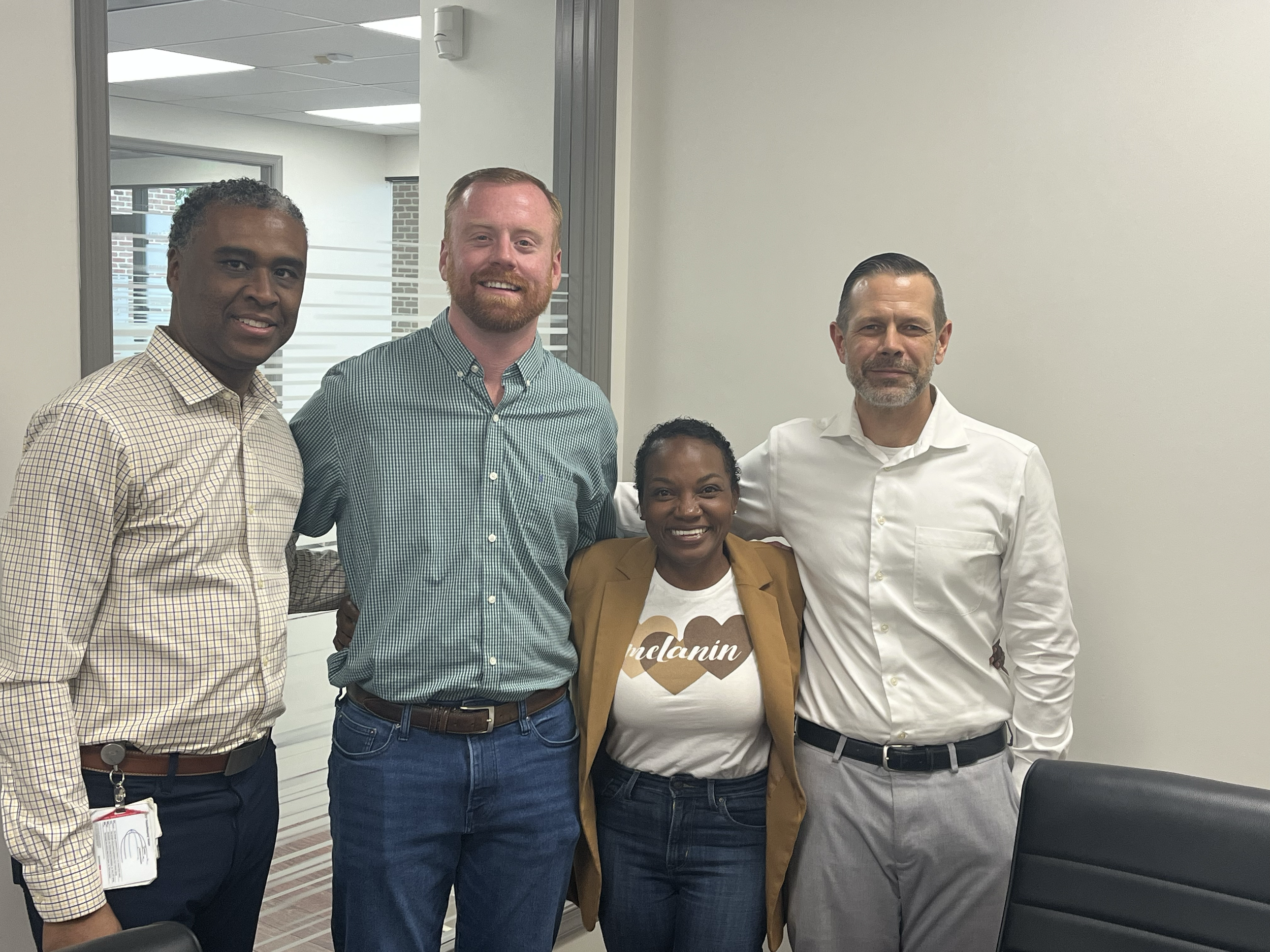 Shane Brazzell with very happy real estate clients after closing in Virginia Beach.